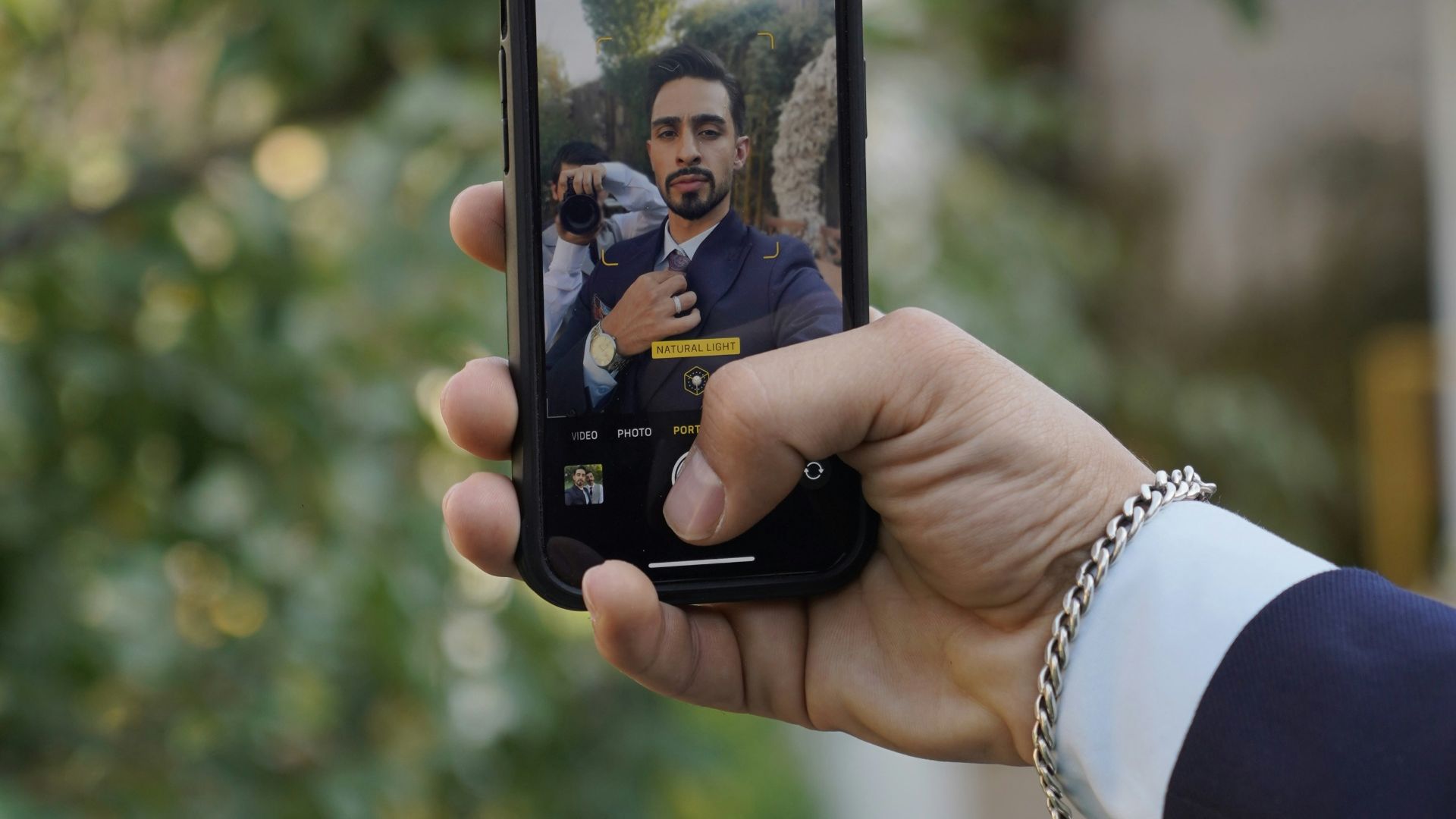 a person taking a picture with a cell phone