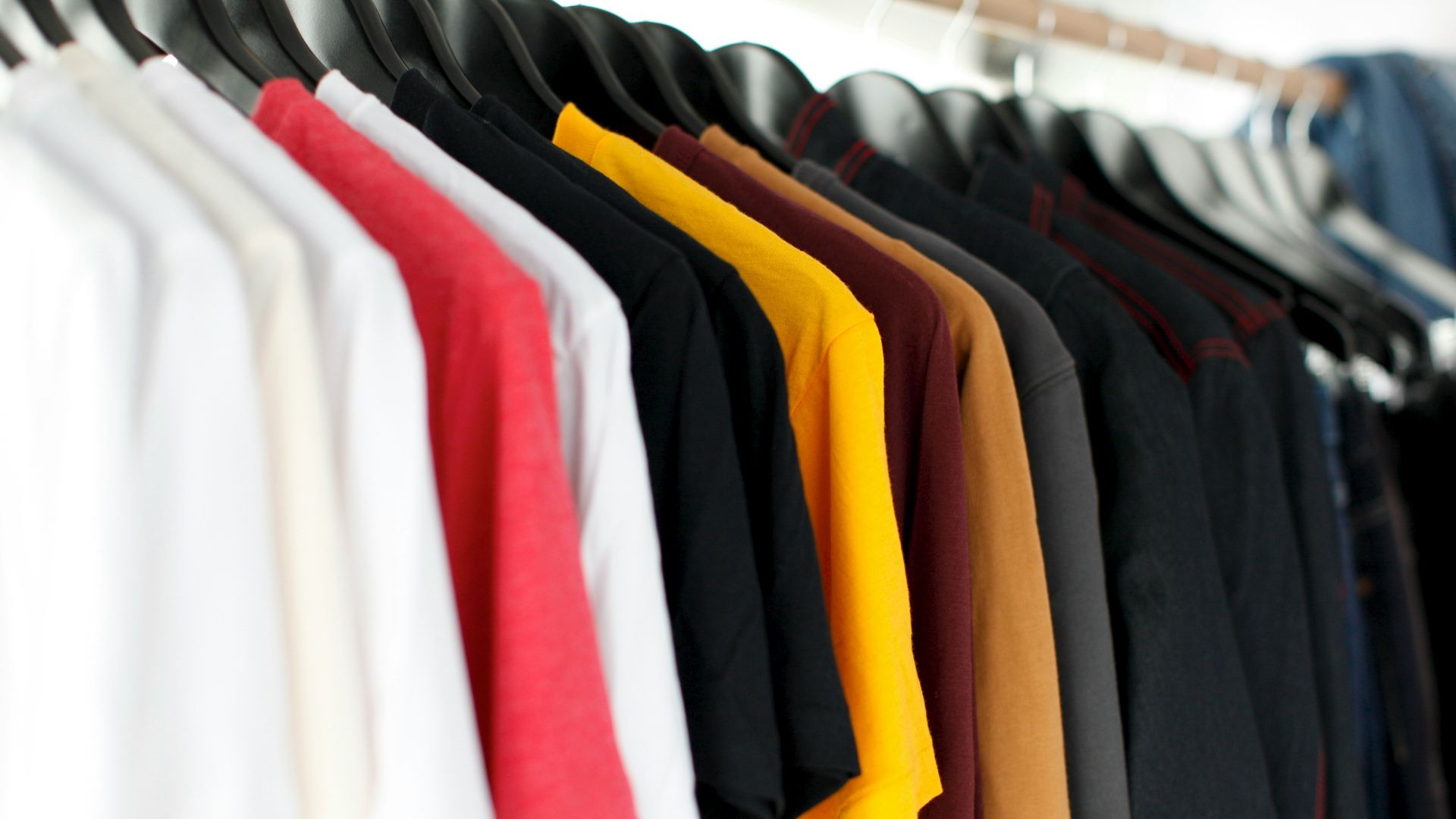 closeup of hanged shirts on rack