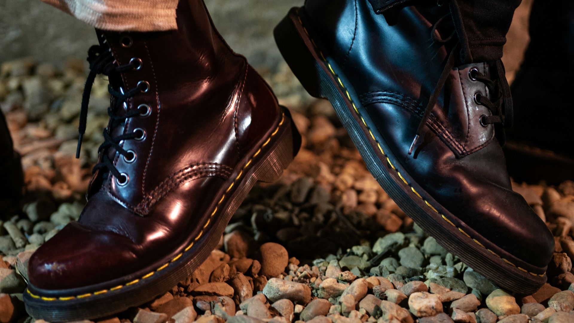 a close up of a pair of shoes on a rocky ground