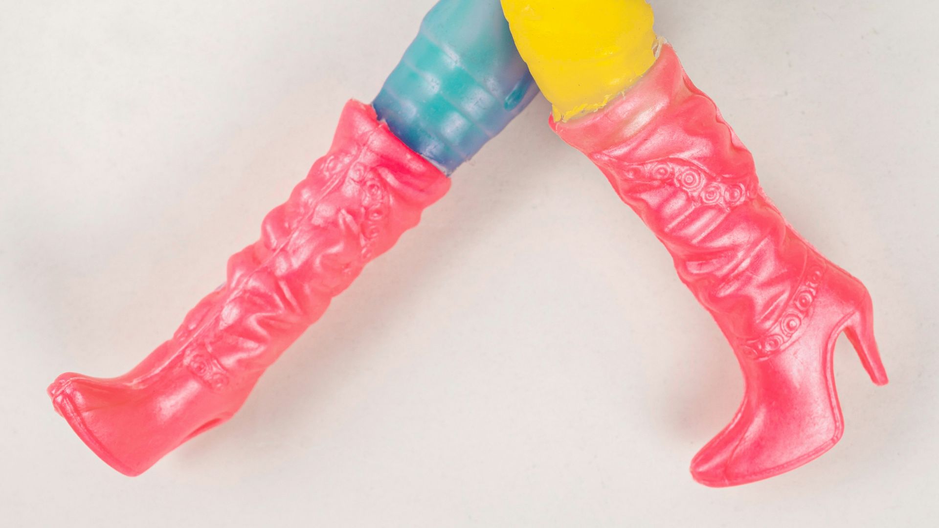 a plastic toothbrush with a yellow and blue handle