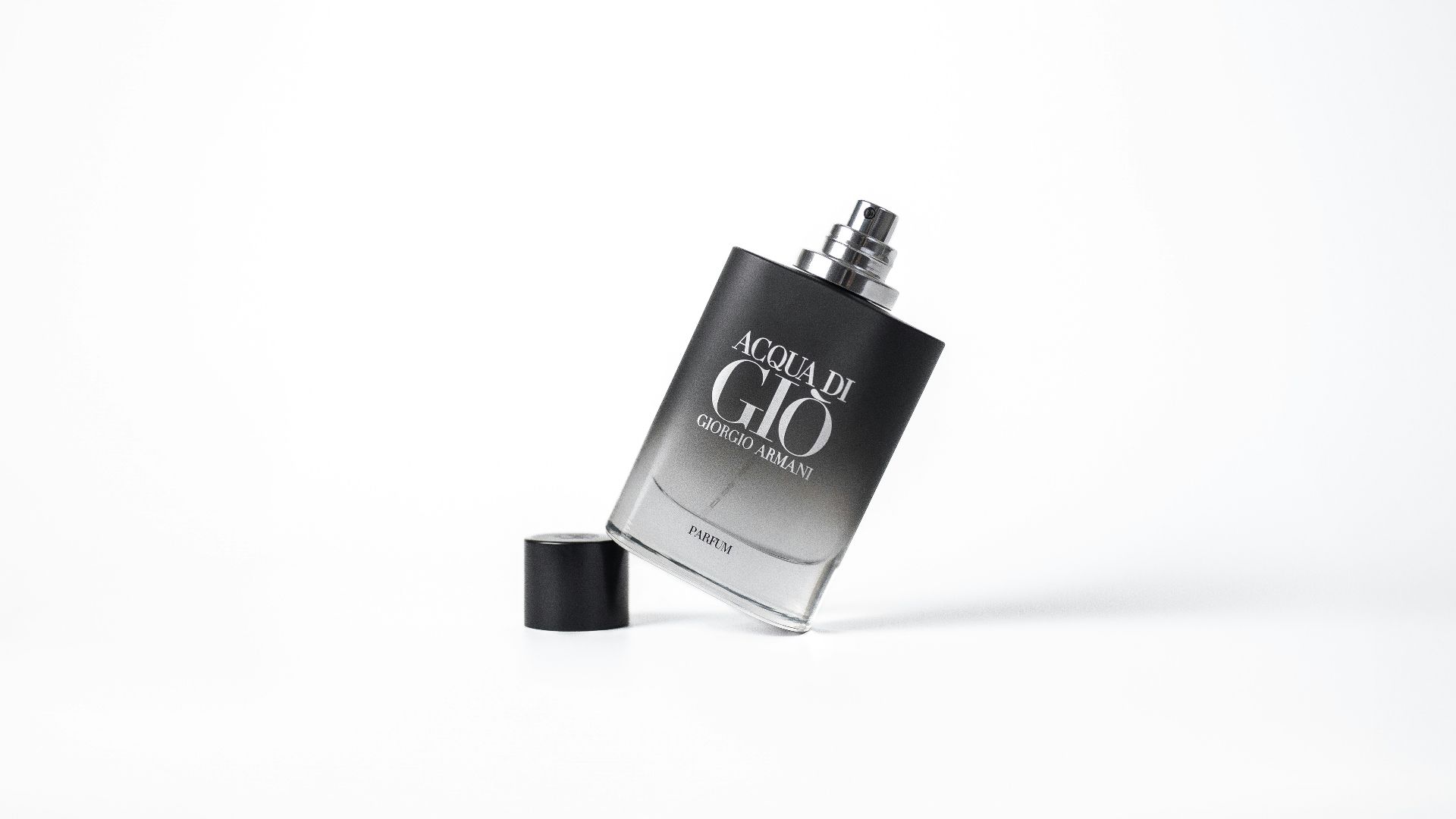 a black and silver flask with a black cap