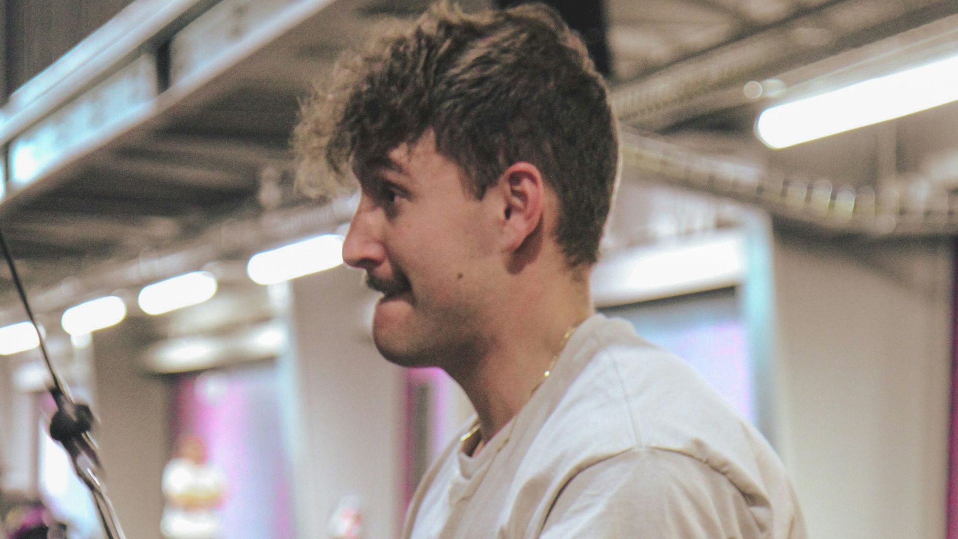 a man holding a pole in a gym