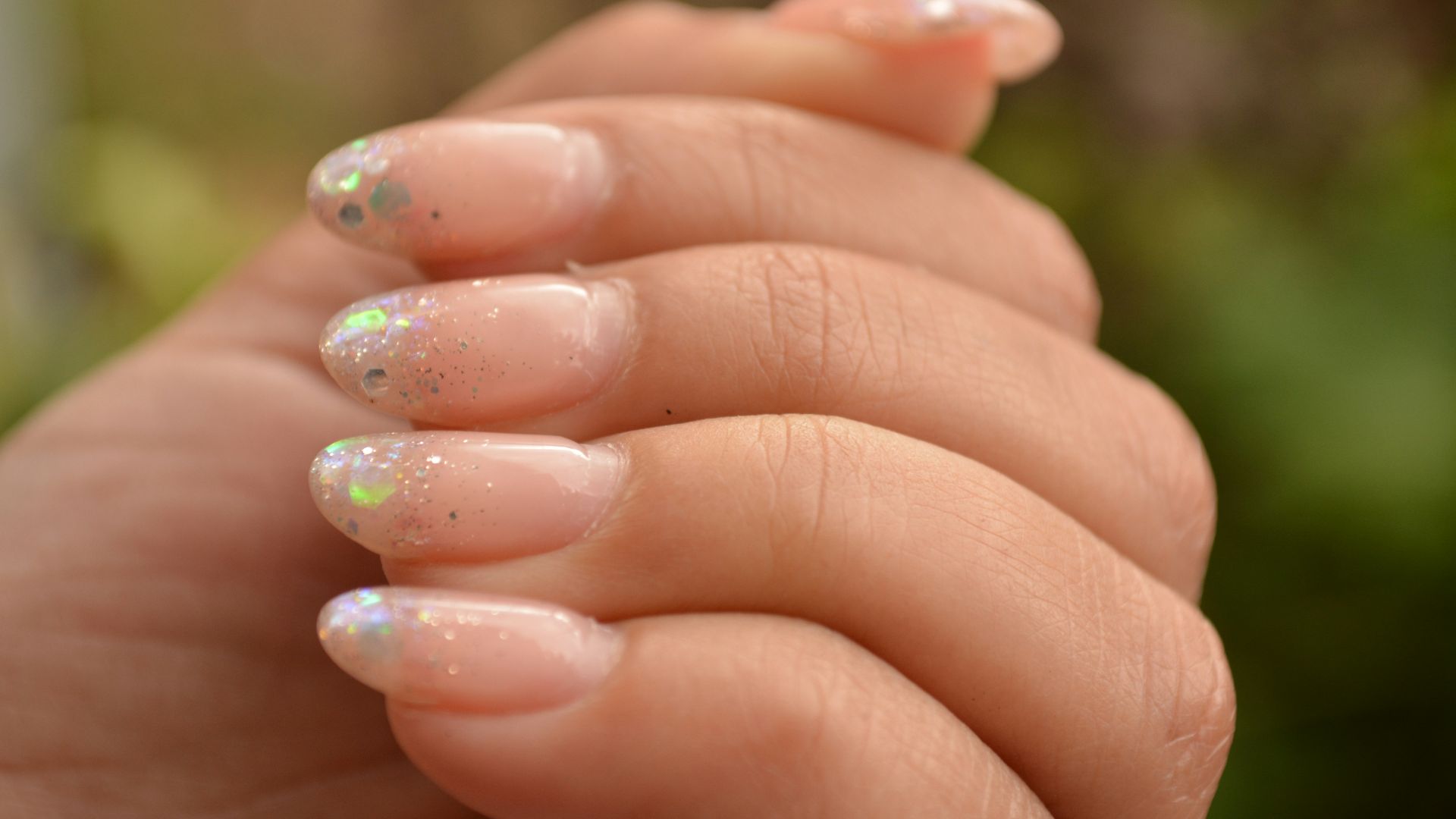 a woman's hand with a manicured nail polish