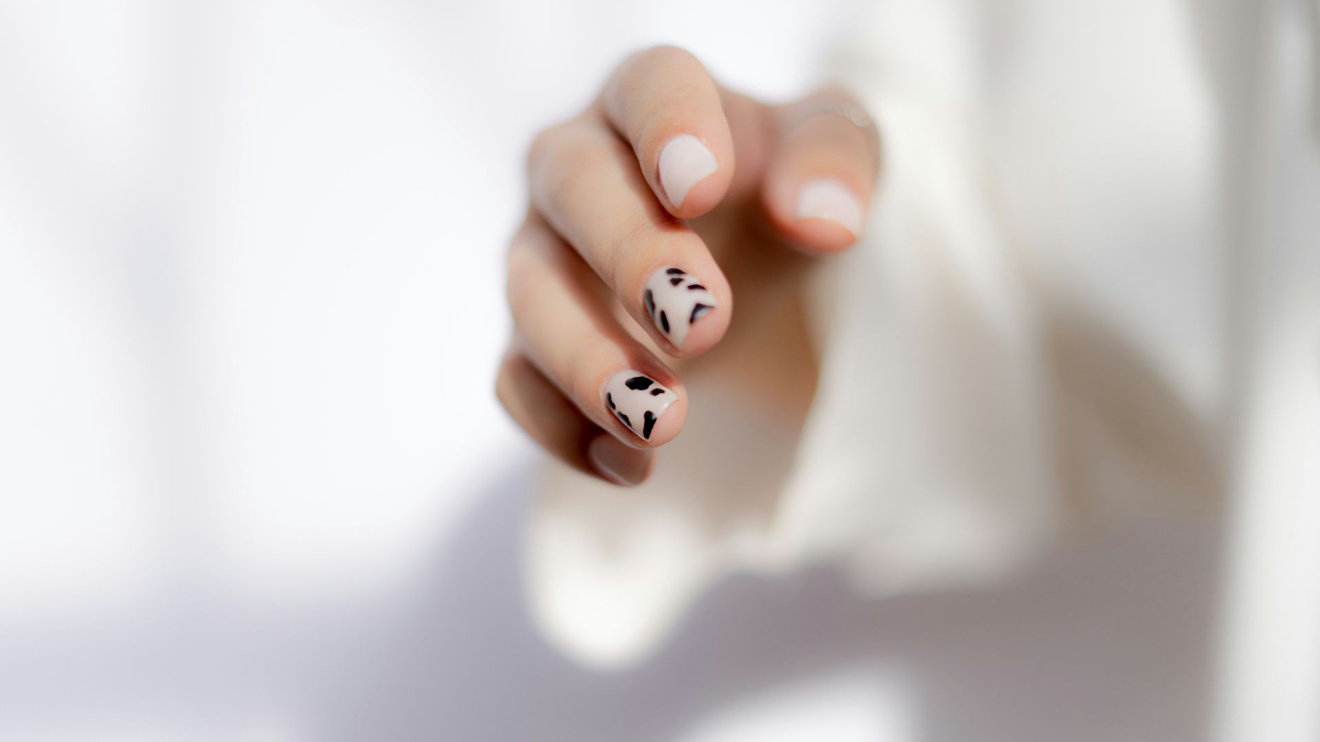 a hand with painted nails