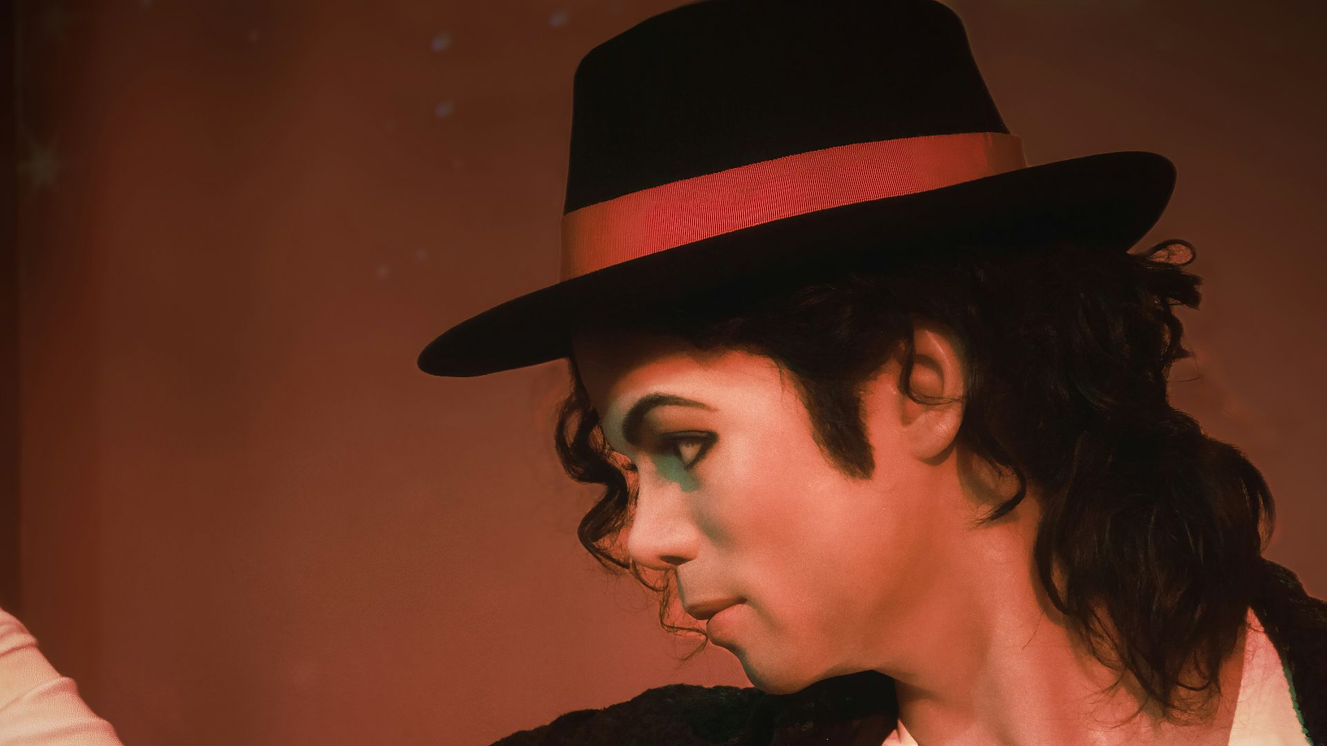 a man in a top hat and black jacket