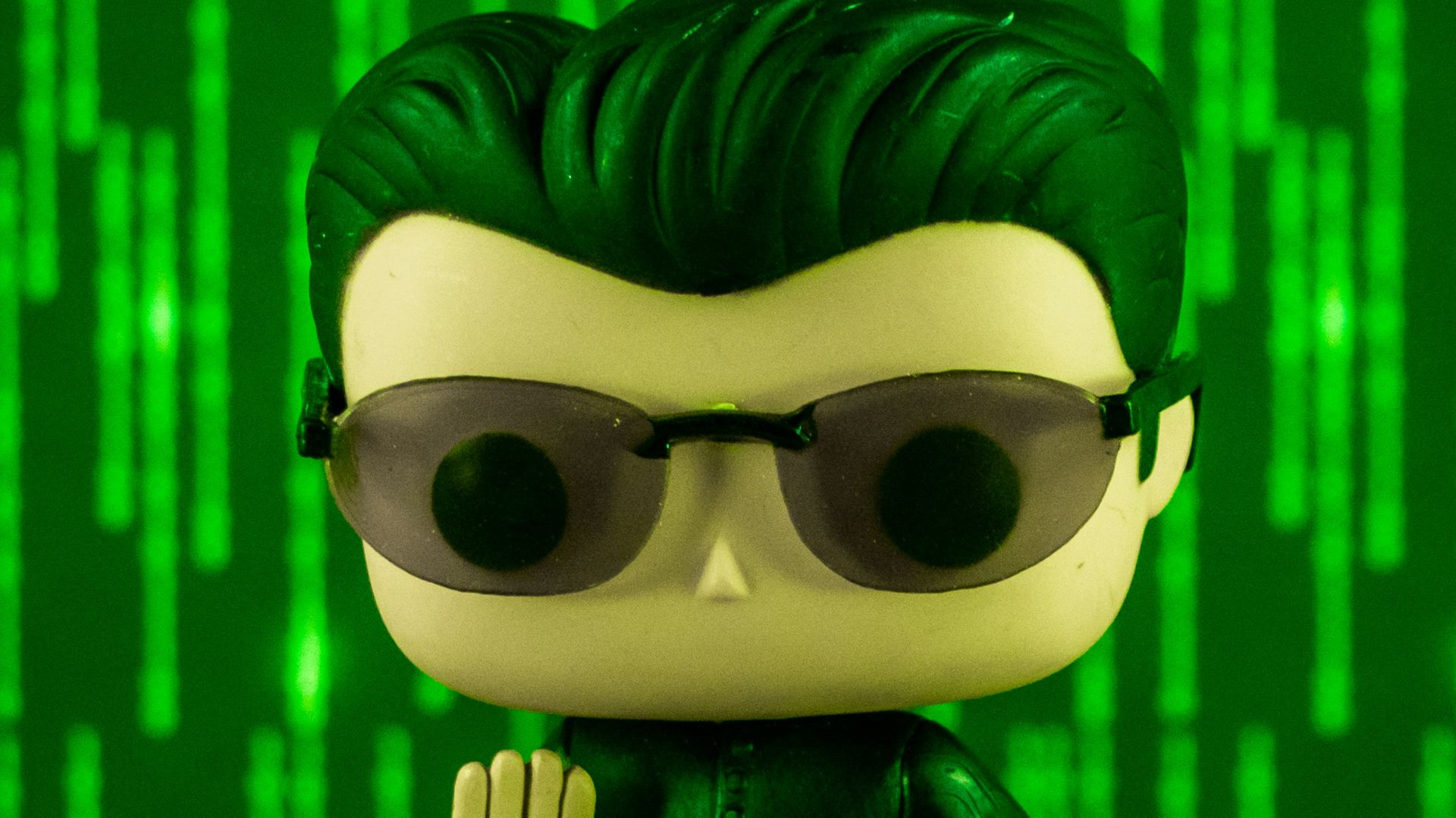 a close up of a figurine of a man wearing sunglasses