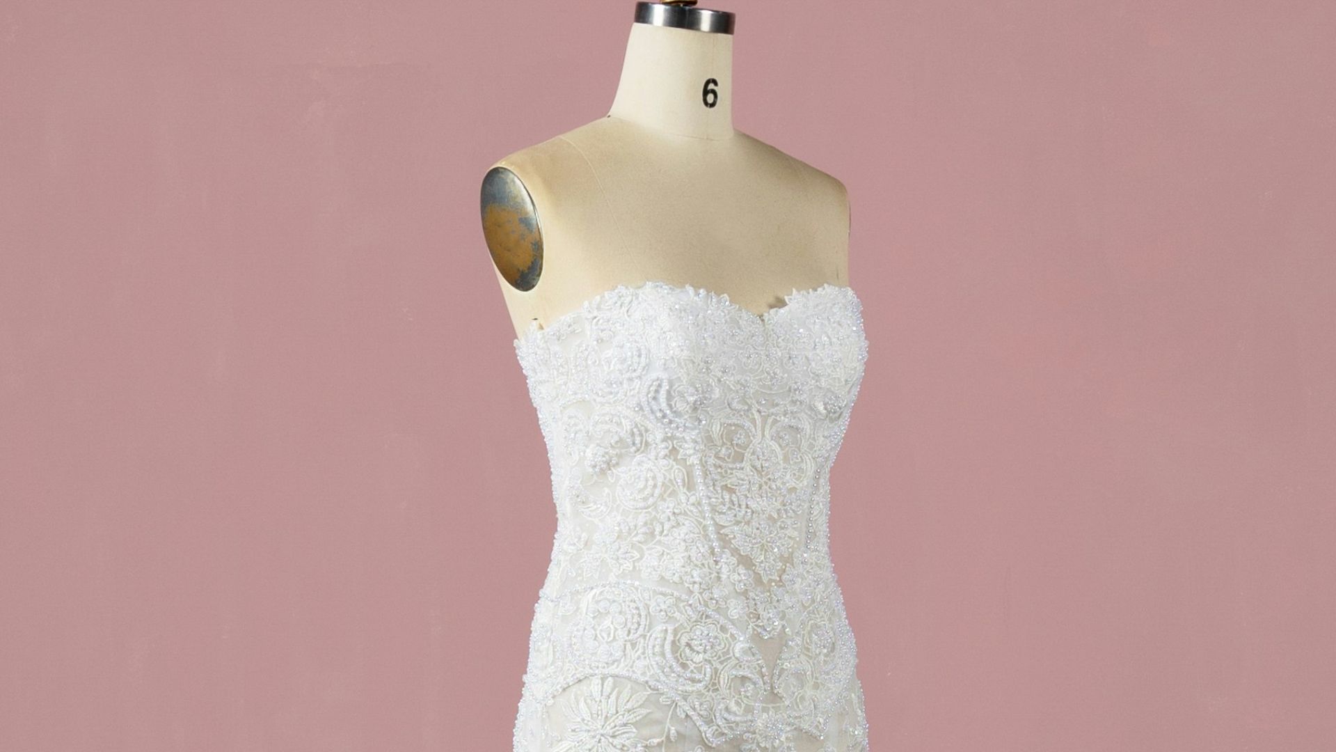 a white wedding dress on a mannequin