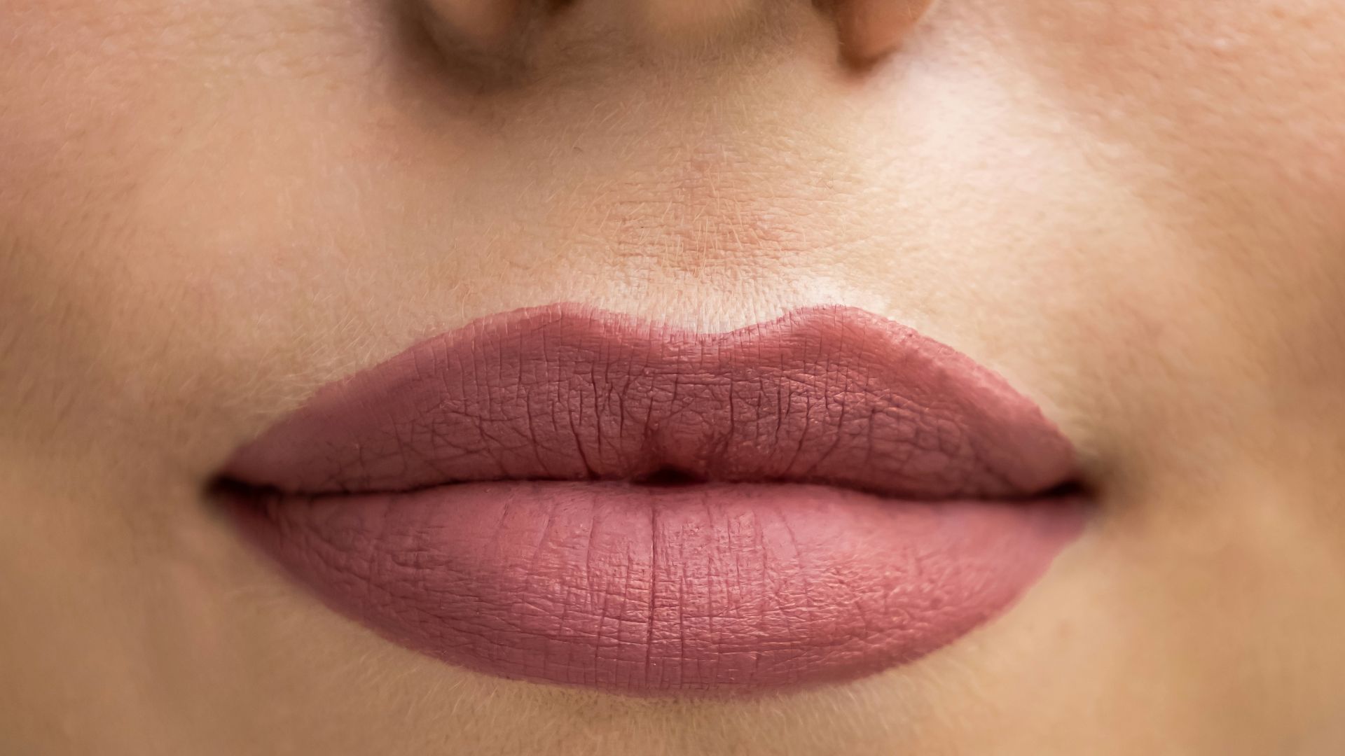 a close up of a woman's lips and nose