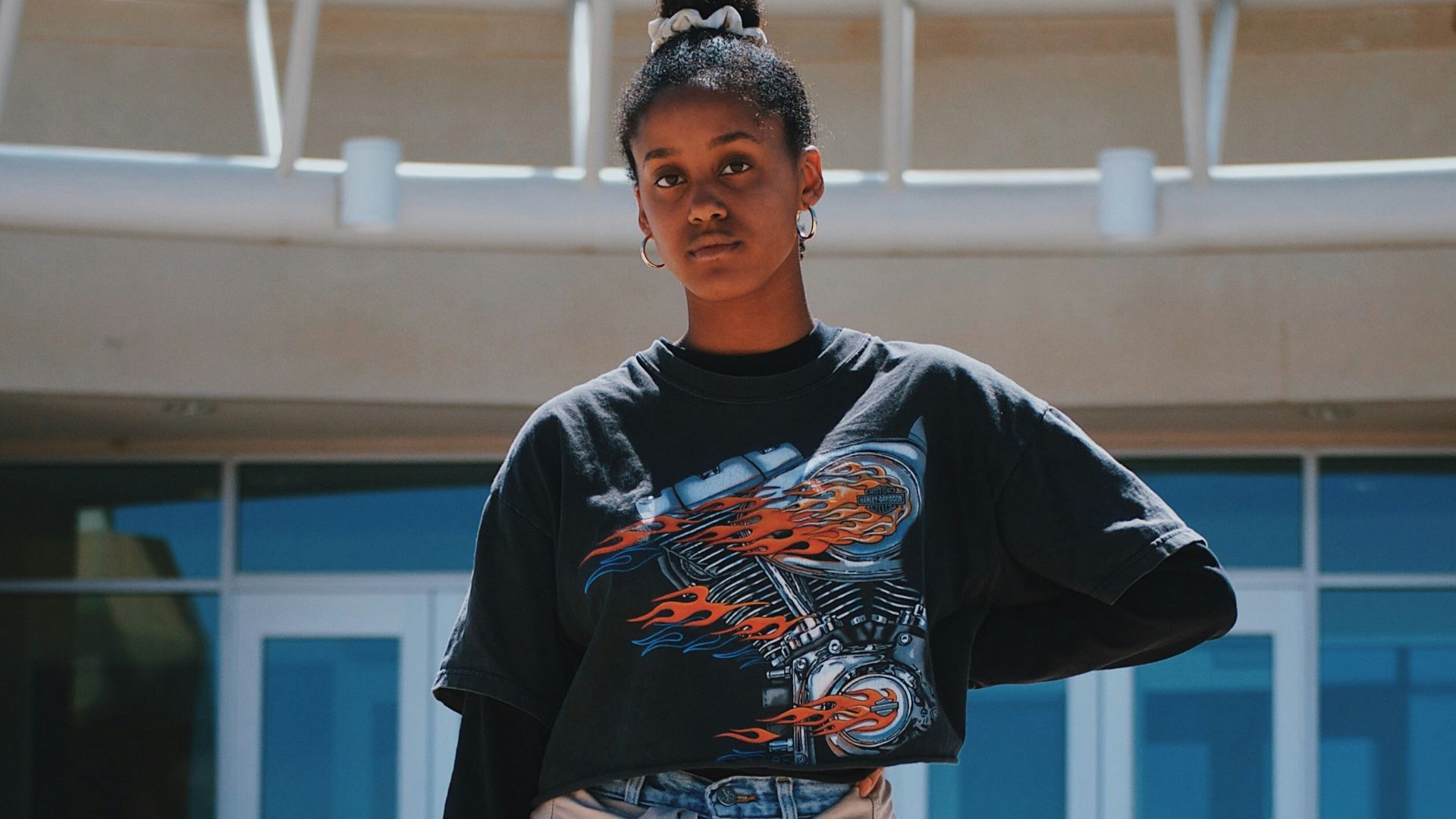 woman standing near building