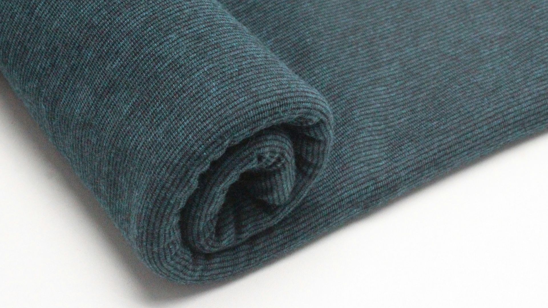 a close up of a blue fabric on a white surface