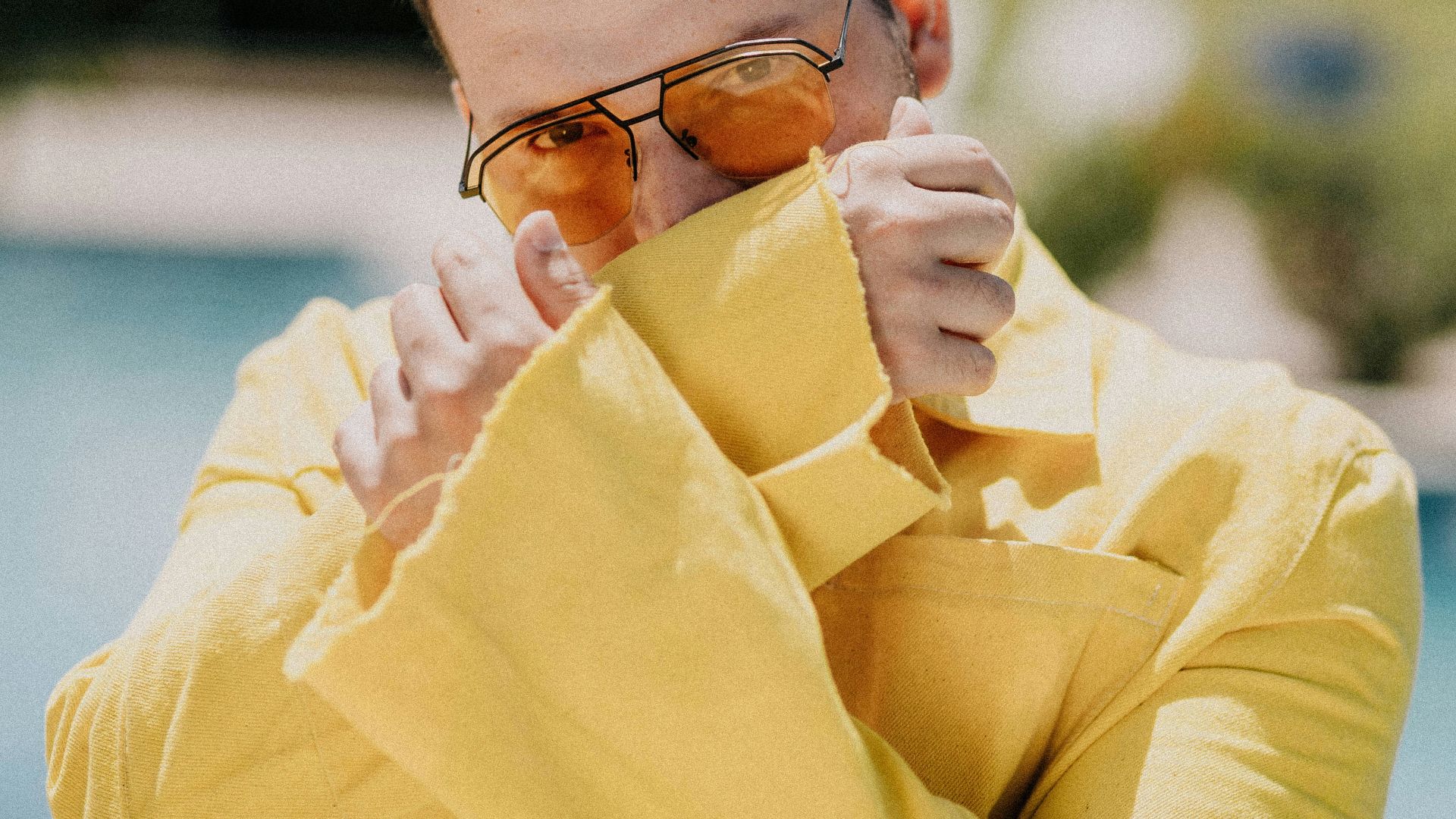 woman in yellow long sleeve shirt wearing black framed eyeglasses