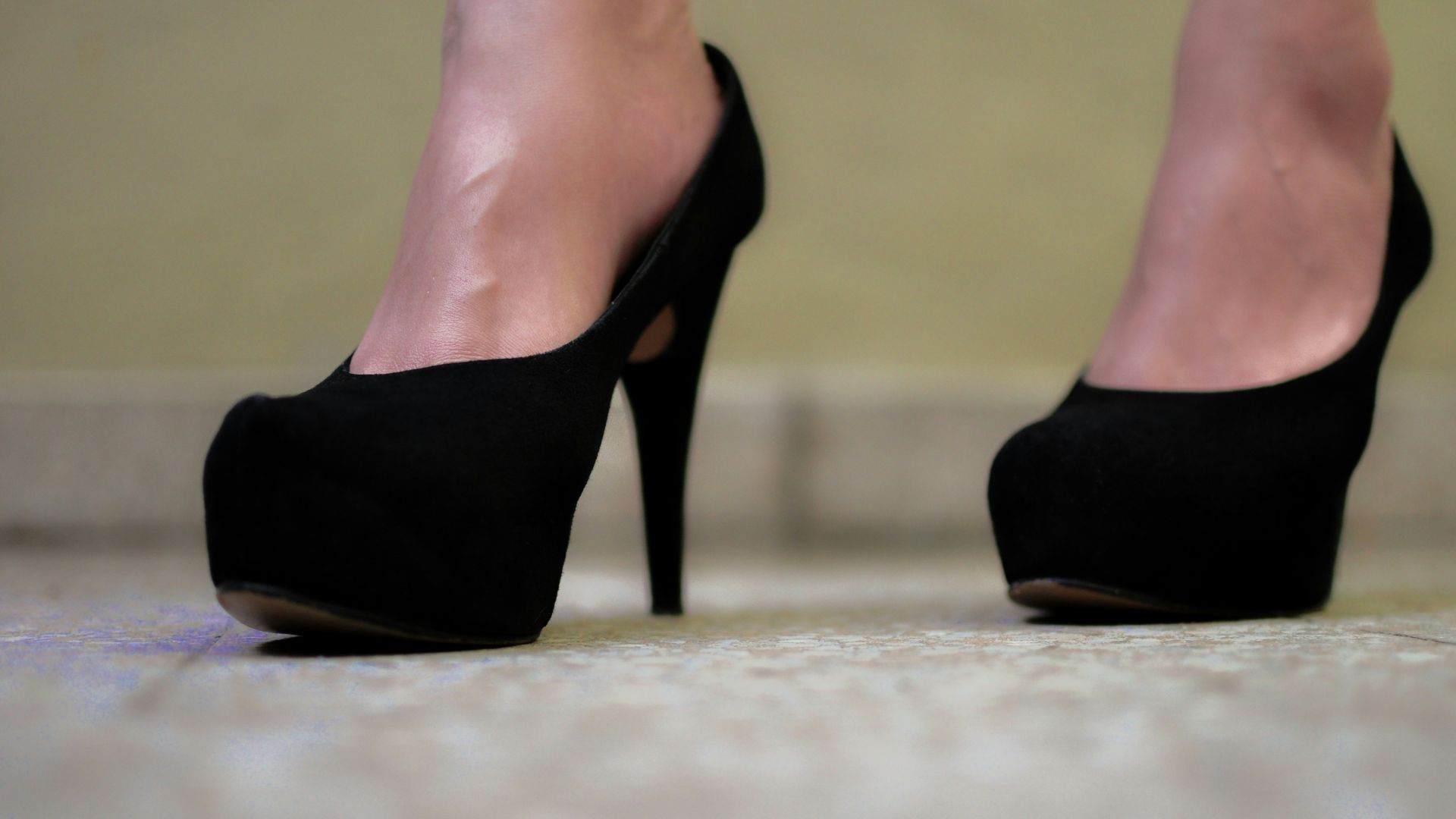 Black platform heels are shown up close.
