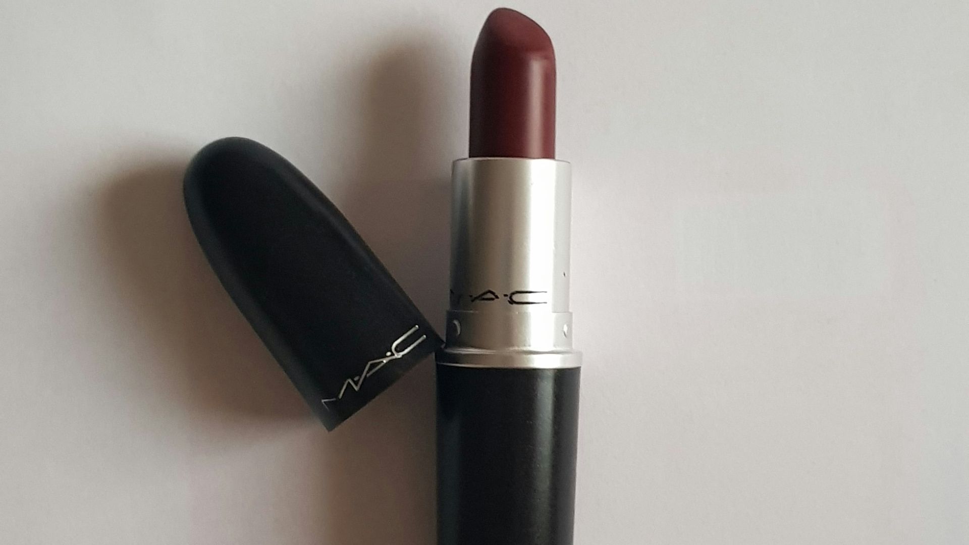 red lipstick on white table