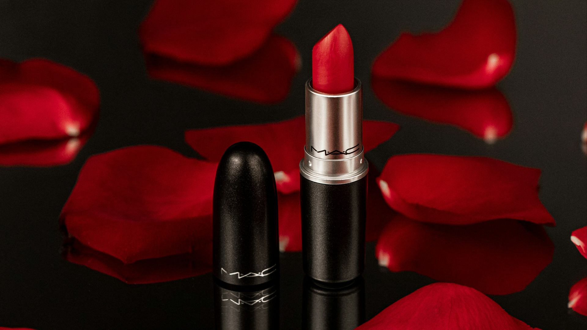 two lipsticks sitting next to each other on a table