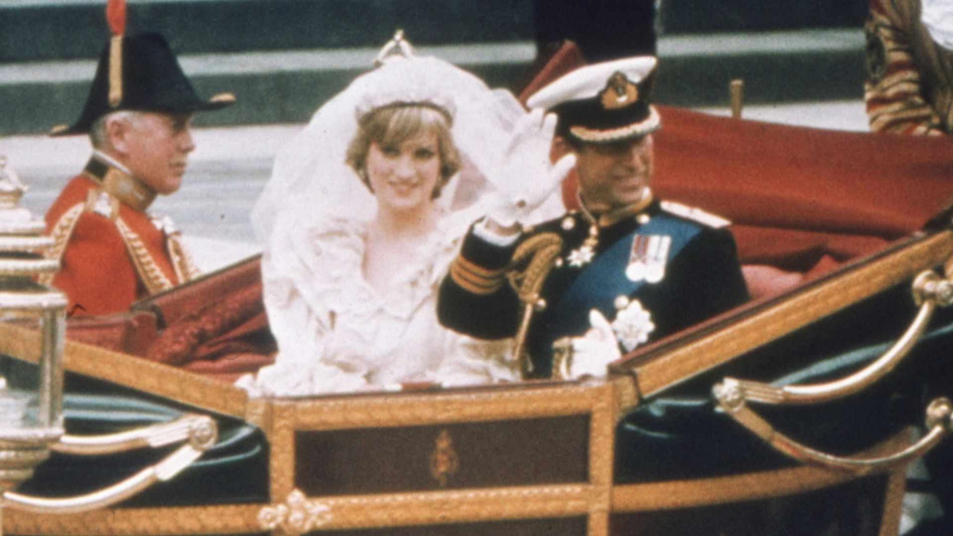 a bride and groom riding in a horse drawn carriage
