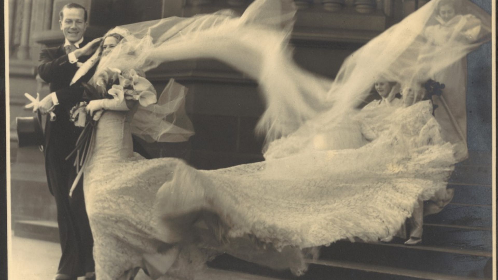 File:(Wind buffets the bride's veil and train at the wedding of Cyril Ritchard and Madge Elliott, St. Mary's Cathedral, Sydney, September 16, 1935) (8446005685).jpg