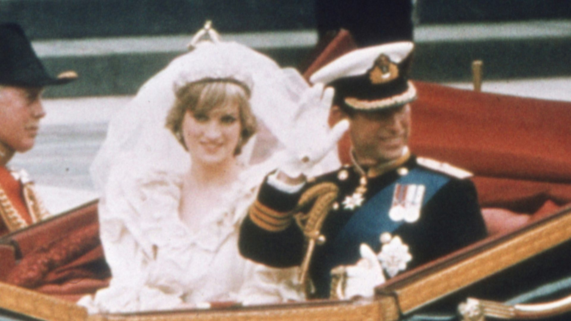 a bride and groom riding in a horse drawn carriage