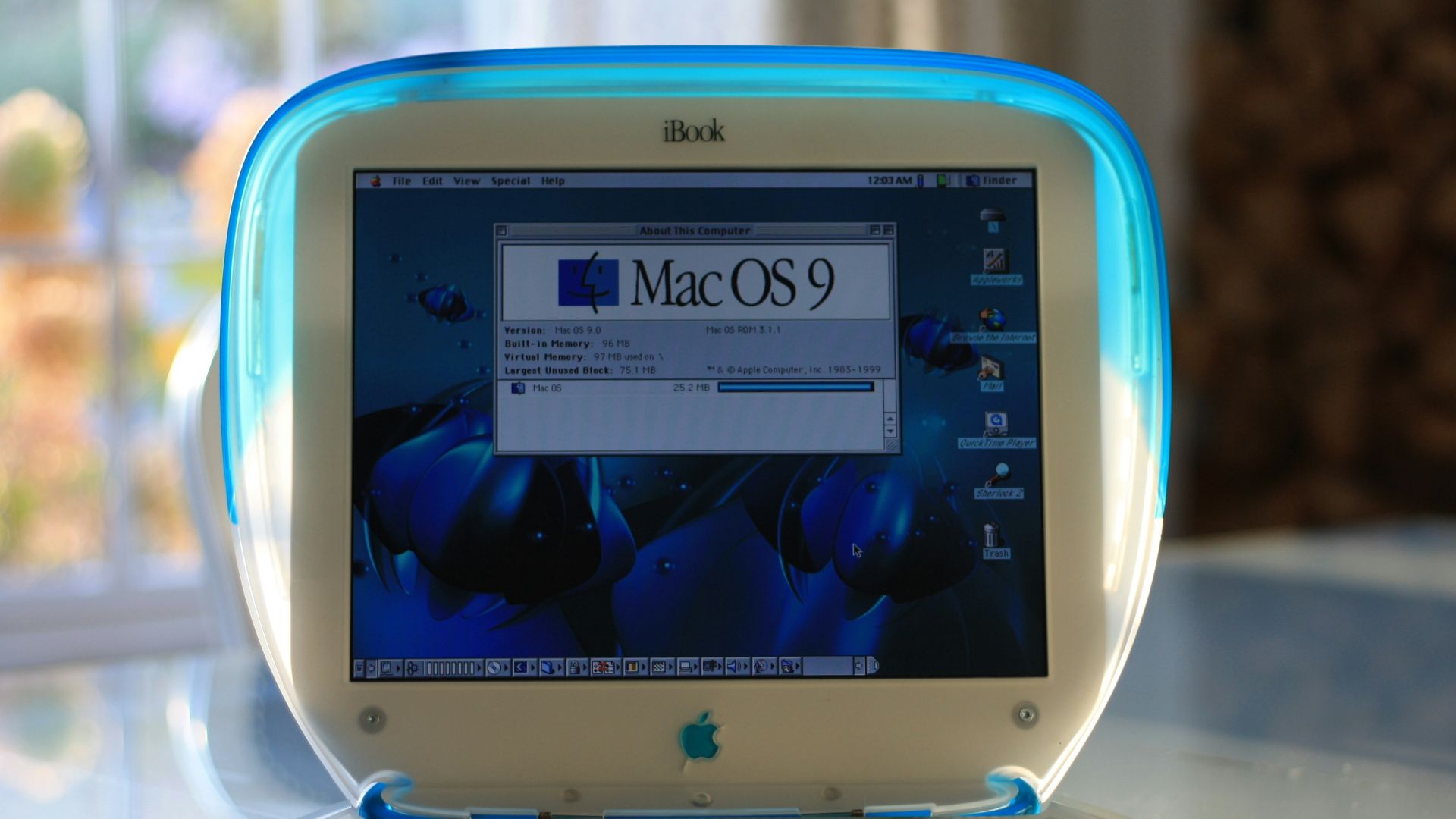 white laptop computer on brown wooden table