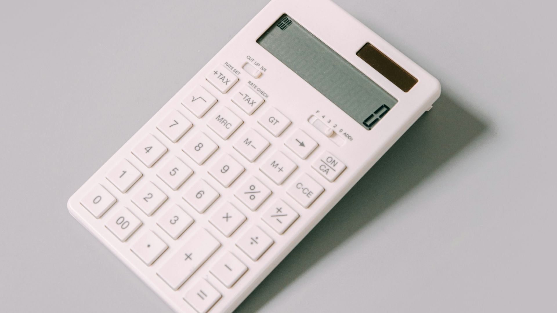 white calculator on white table