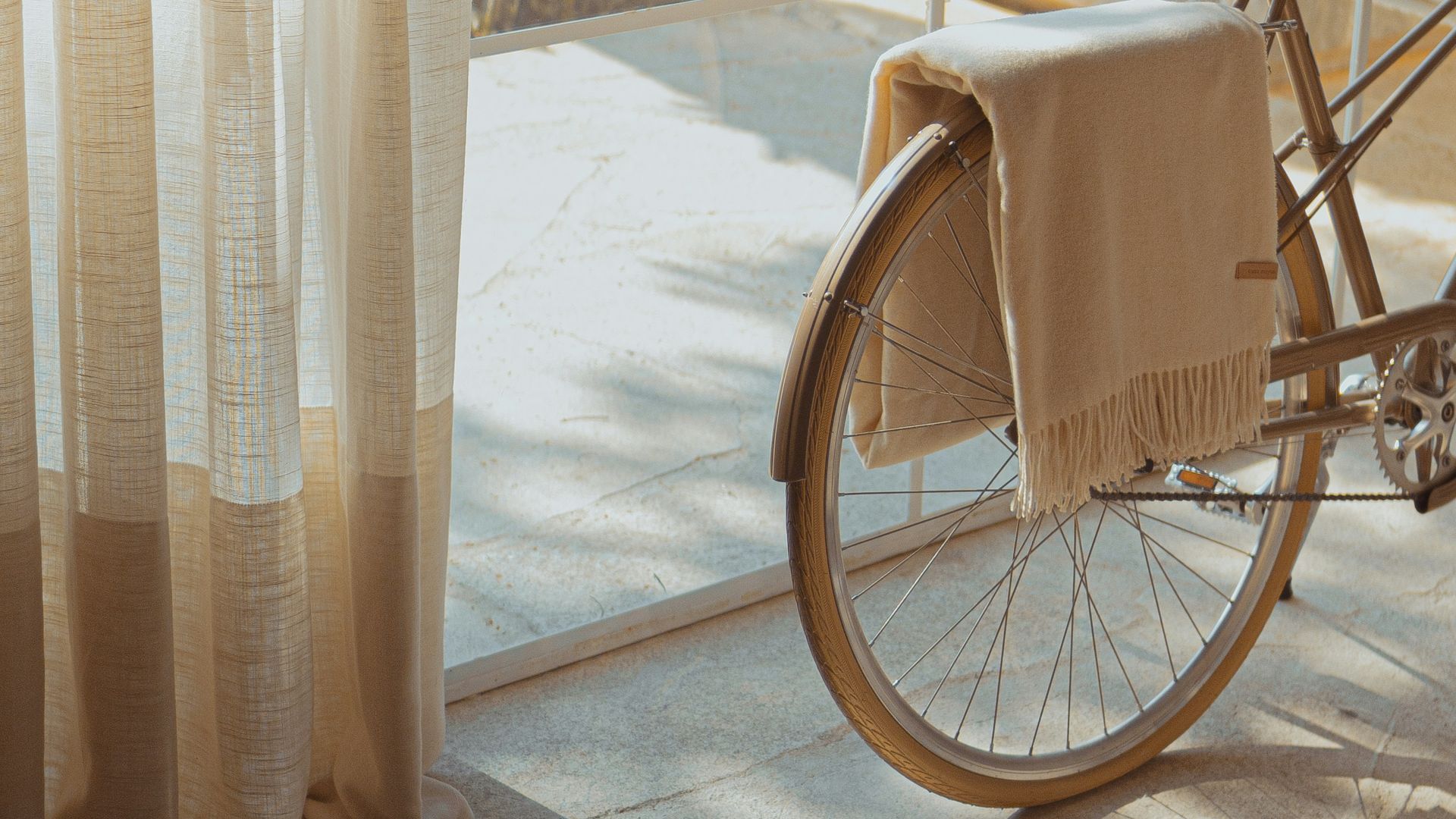 white bike near glass wall