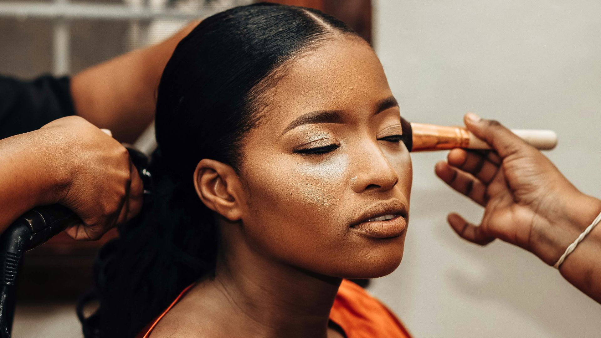 a woman getting her hair done