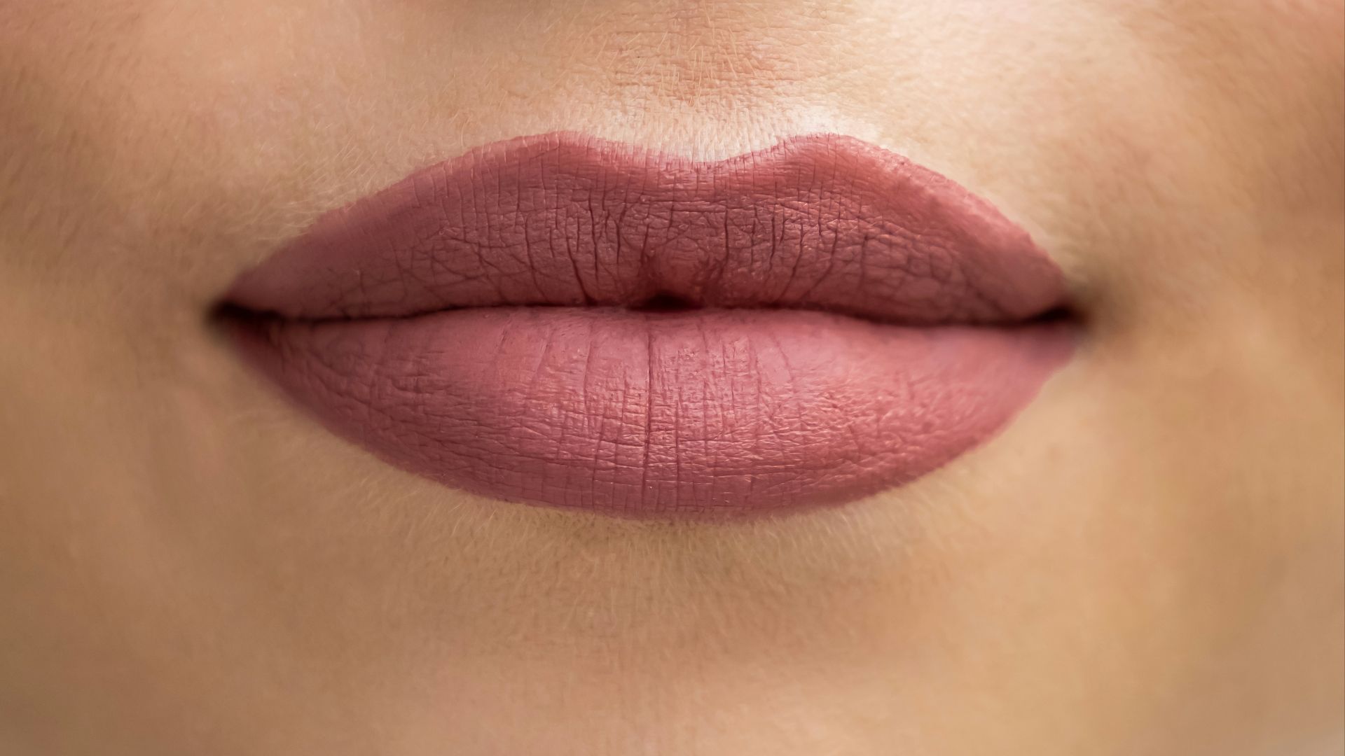 a close up of a woman's lips and nose