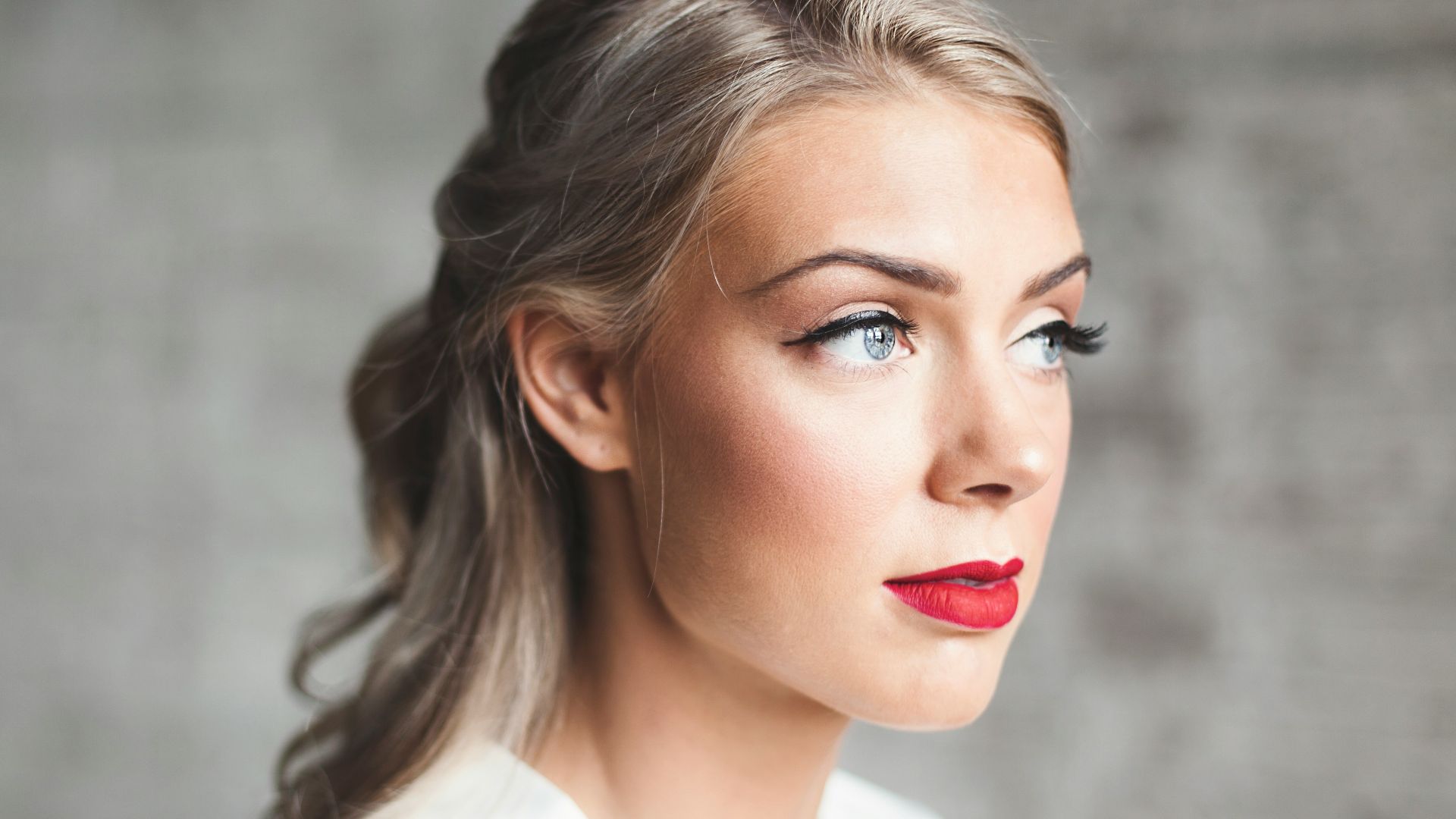 woman wearing white shirt with red lipstick