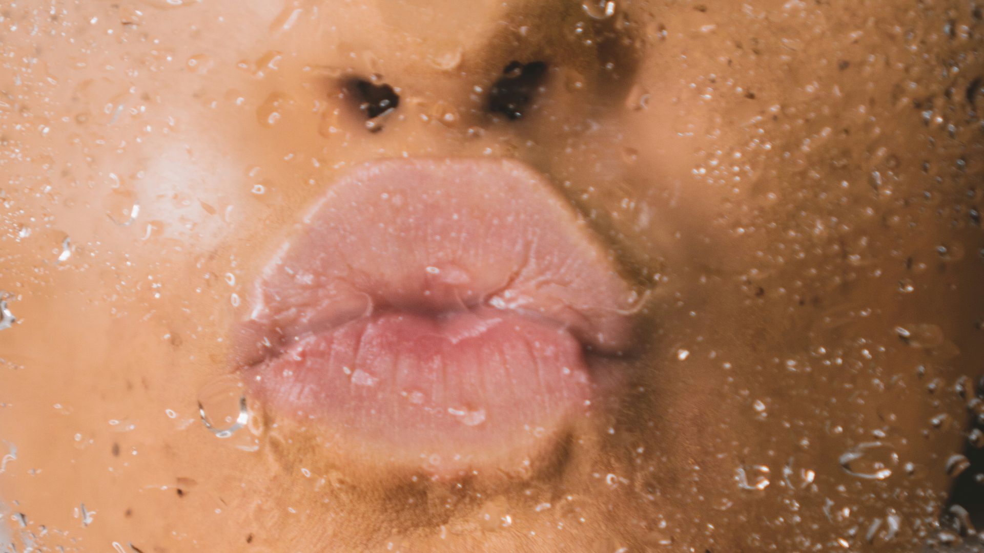 woman in water with water droplets