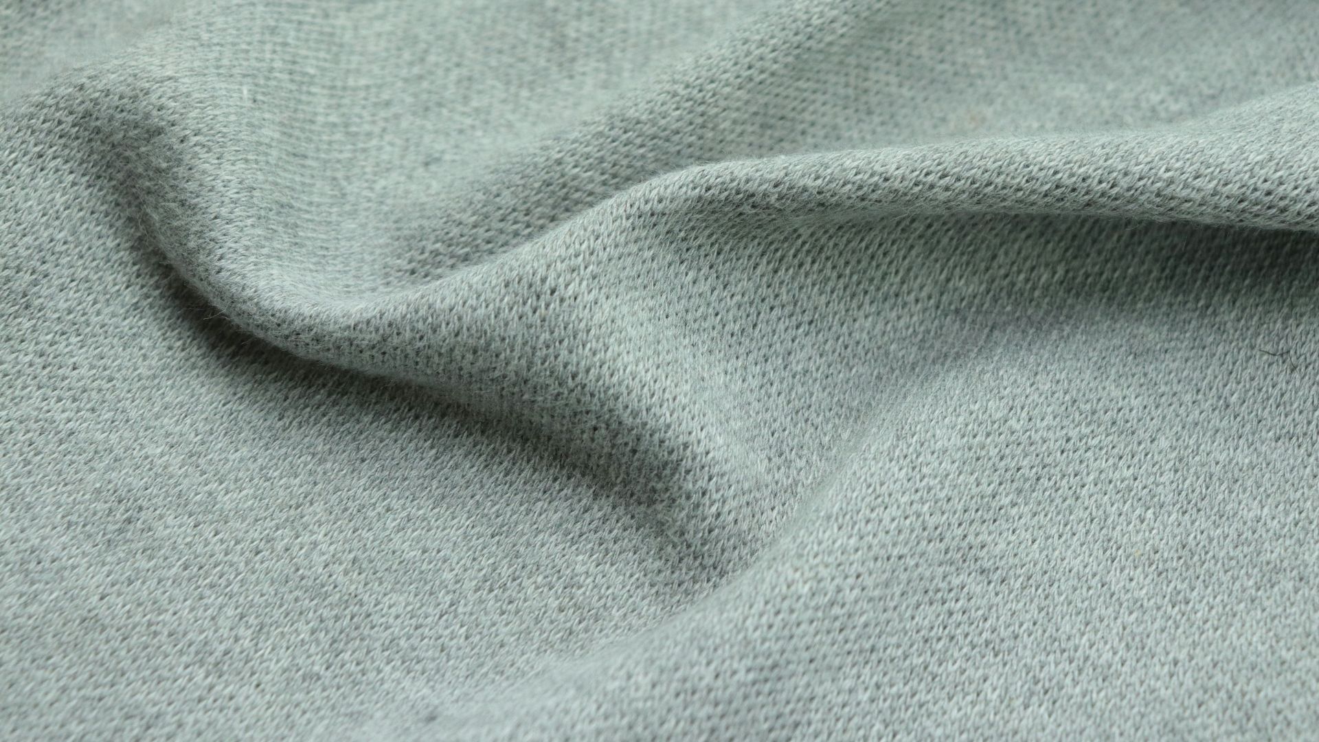 a close up view of a light green fabric
