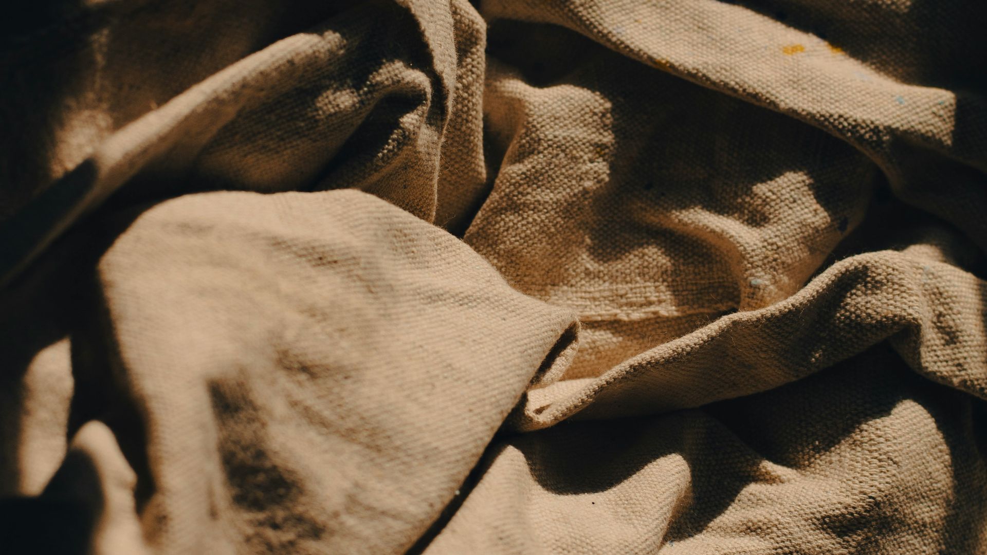 a close up of a blanket on a bed