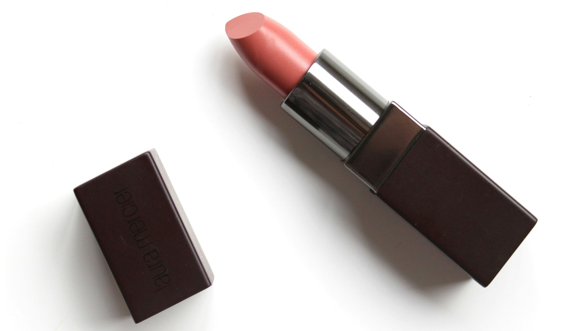 red lipstick on white surface