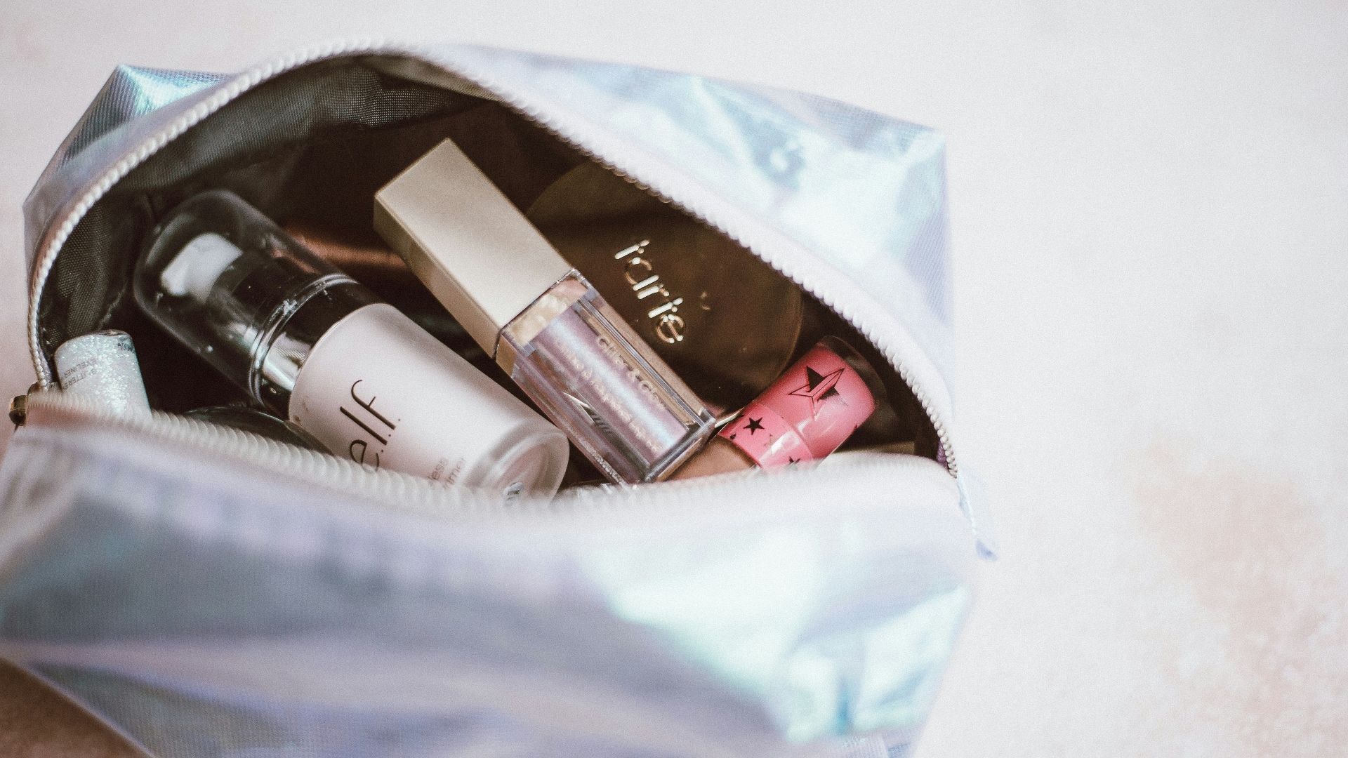 cosmetics in gray bag