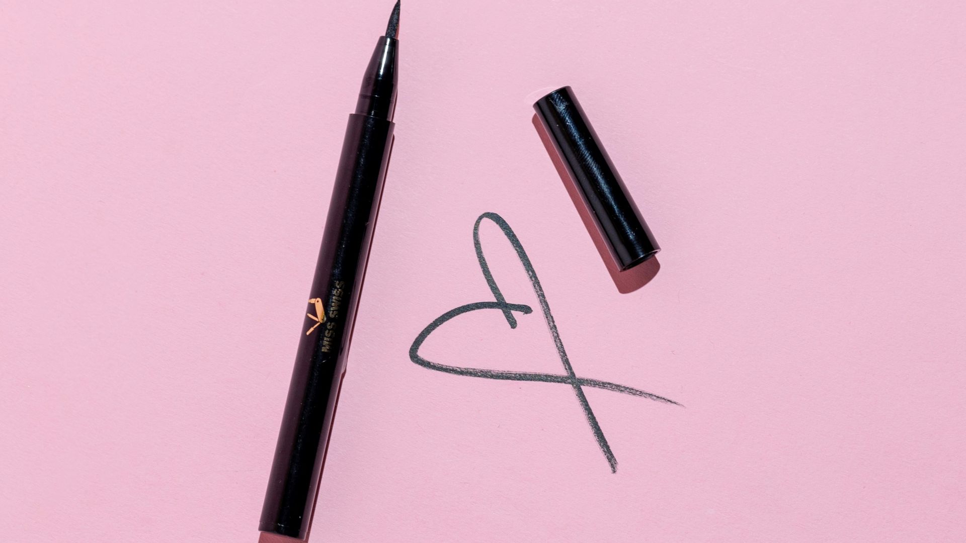 black pen and black framed eyeglasses