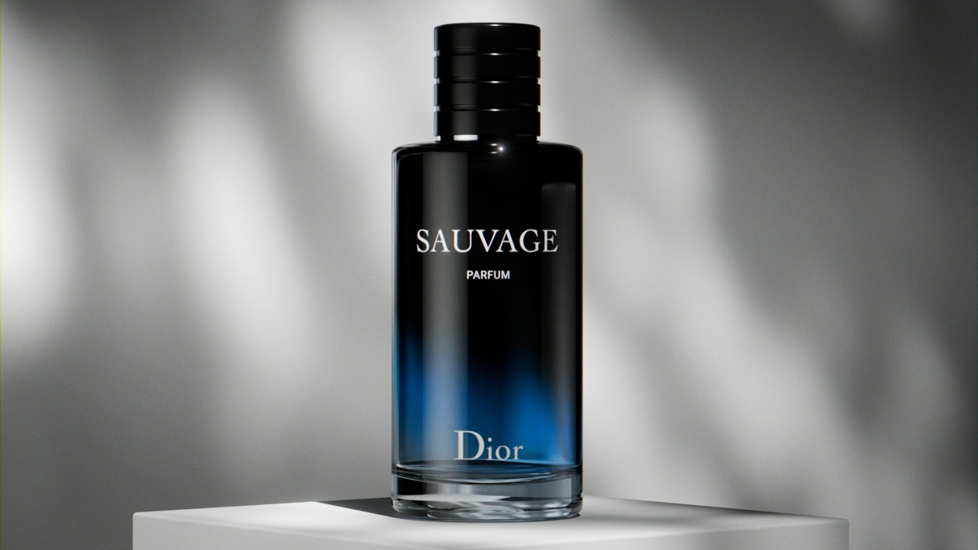 a bottle of cologne sitting on top of a white block