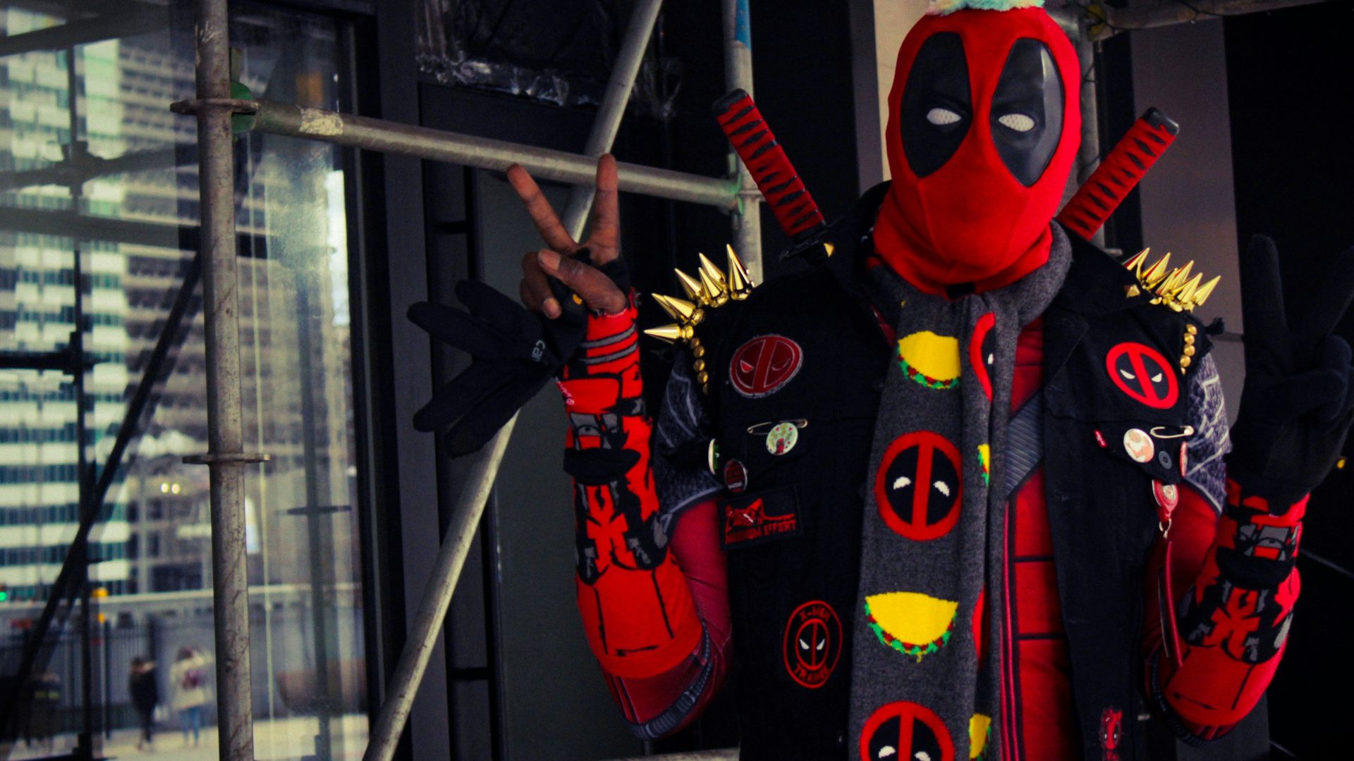 a man dressed in a deadpool costume