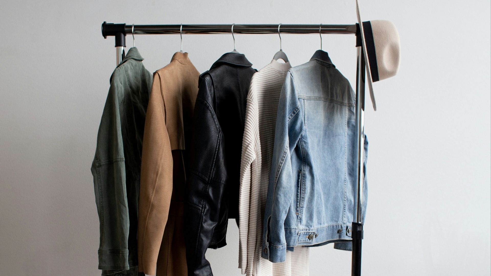 five jackets on clothes rack