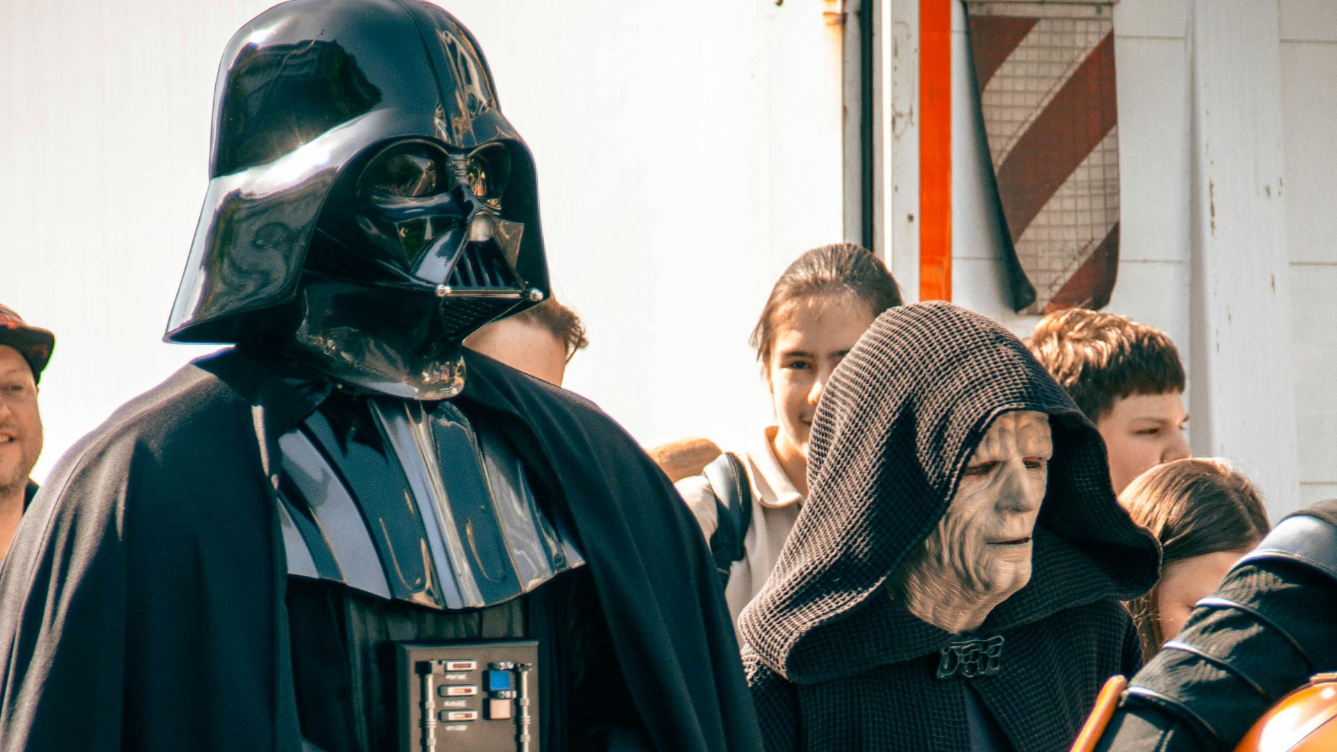 Darth vader, palpatine, and an imperial officer walk.