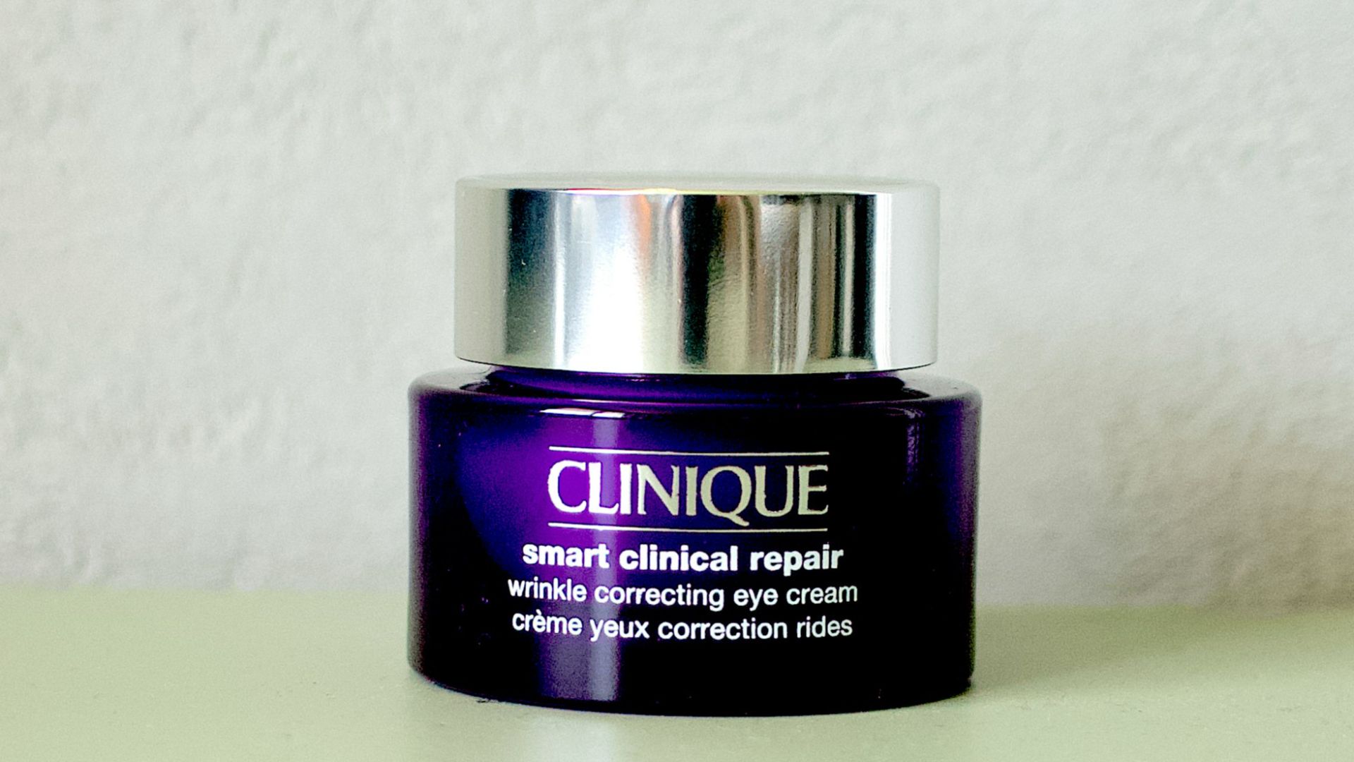 a bottle of clinique on a table