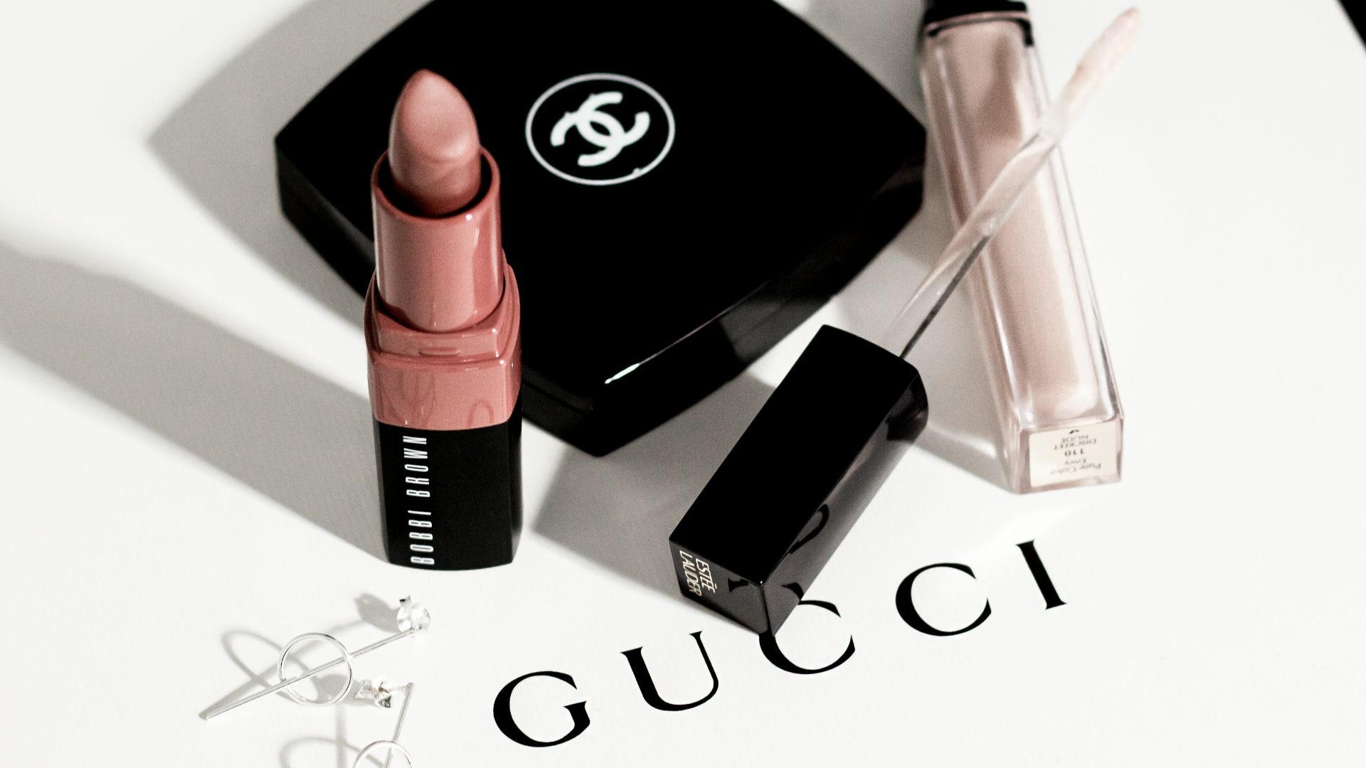 black and pink lipstick and black eyeshadow palette