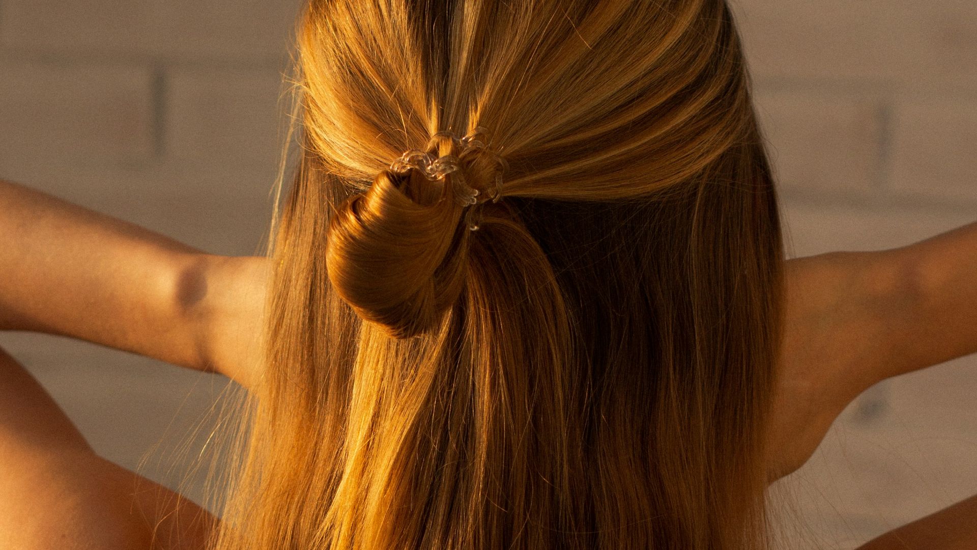 woman in black tank top raising her hands