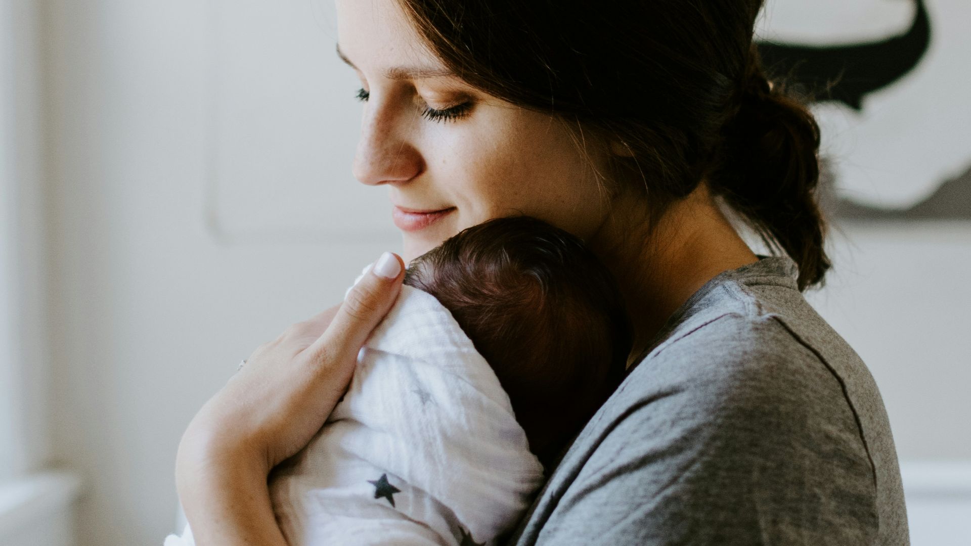 mother carrying baby