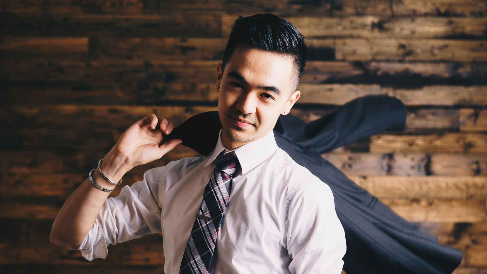 smiling man wearing suit standing