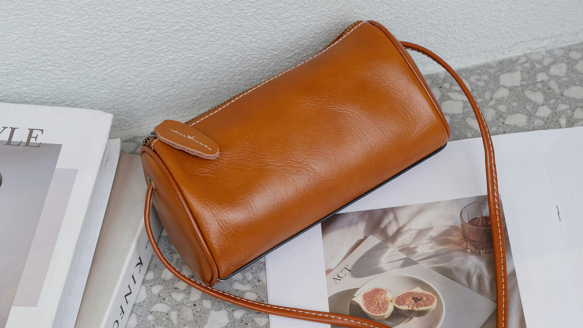 A brown purse sitting on top of a table