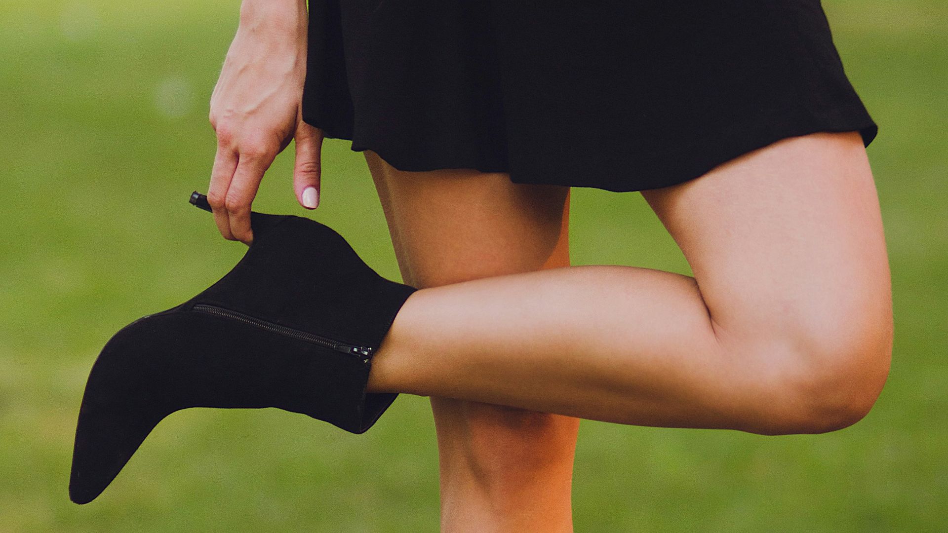 woman in black boots