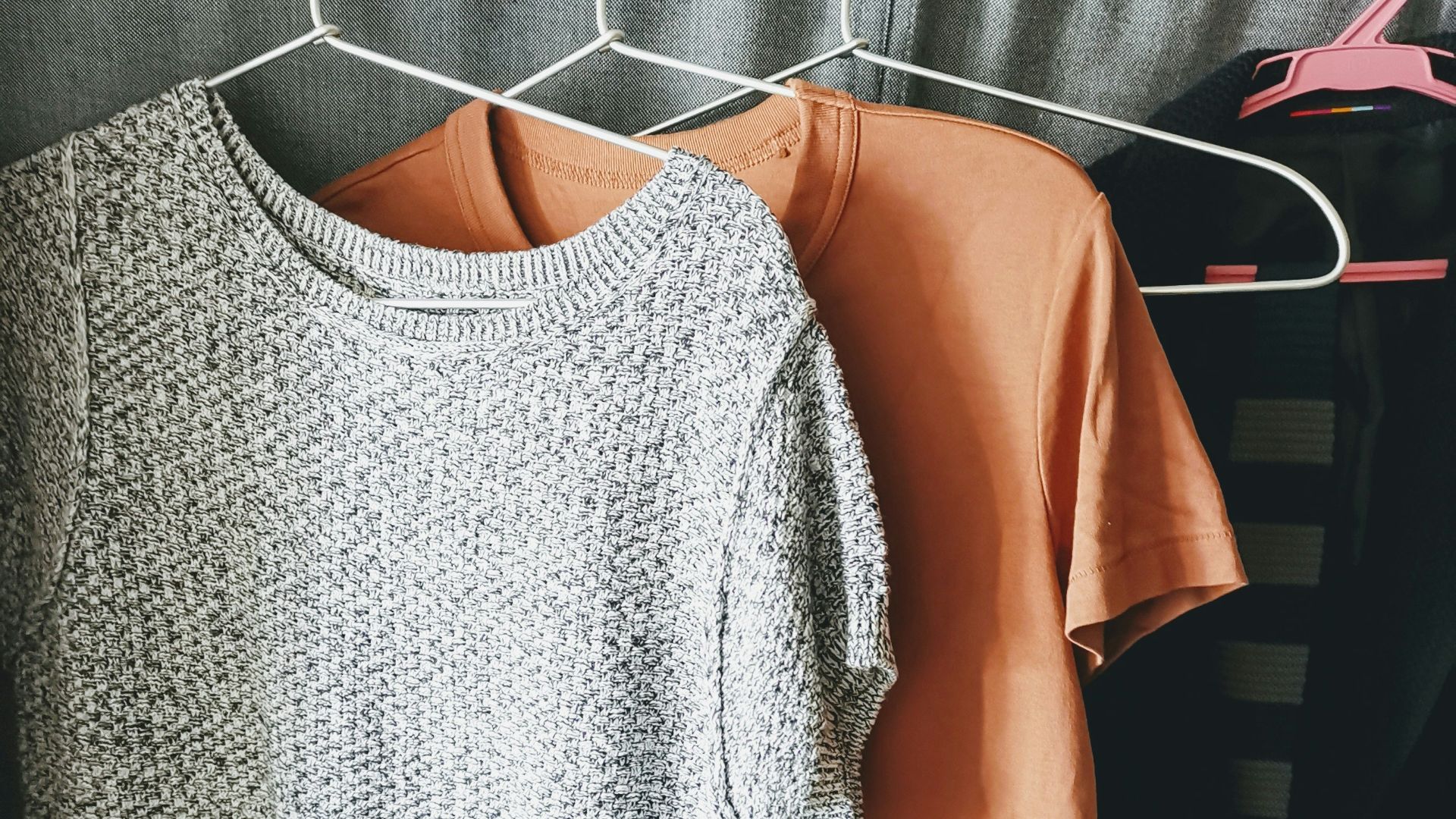 three assorted-color shirts