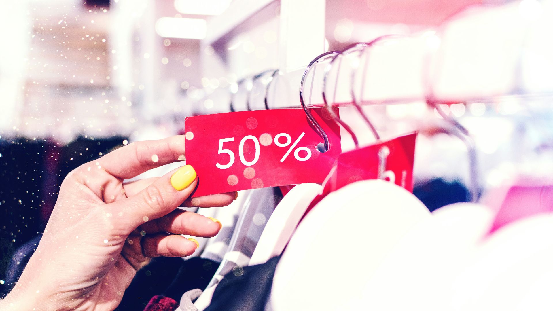 person holding red and white love print gift wrapper