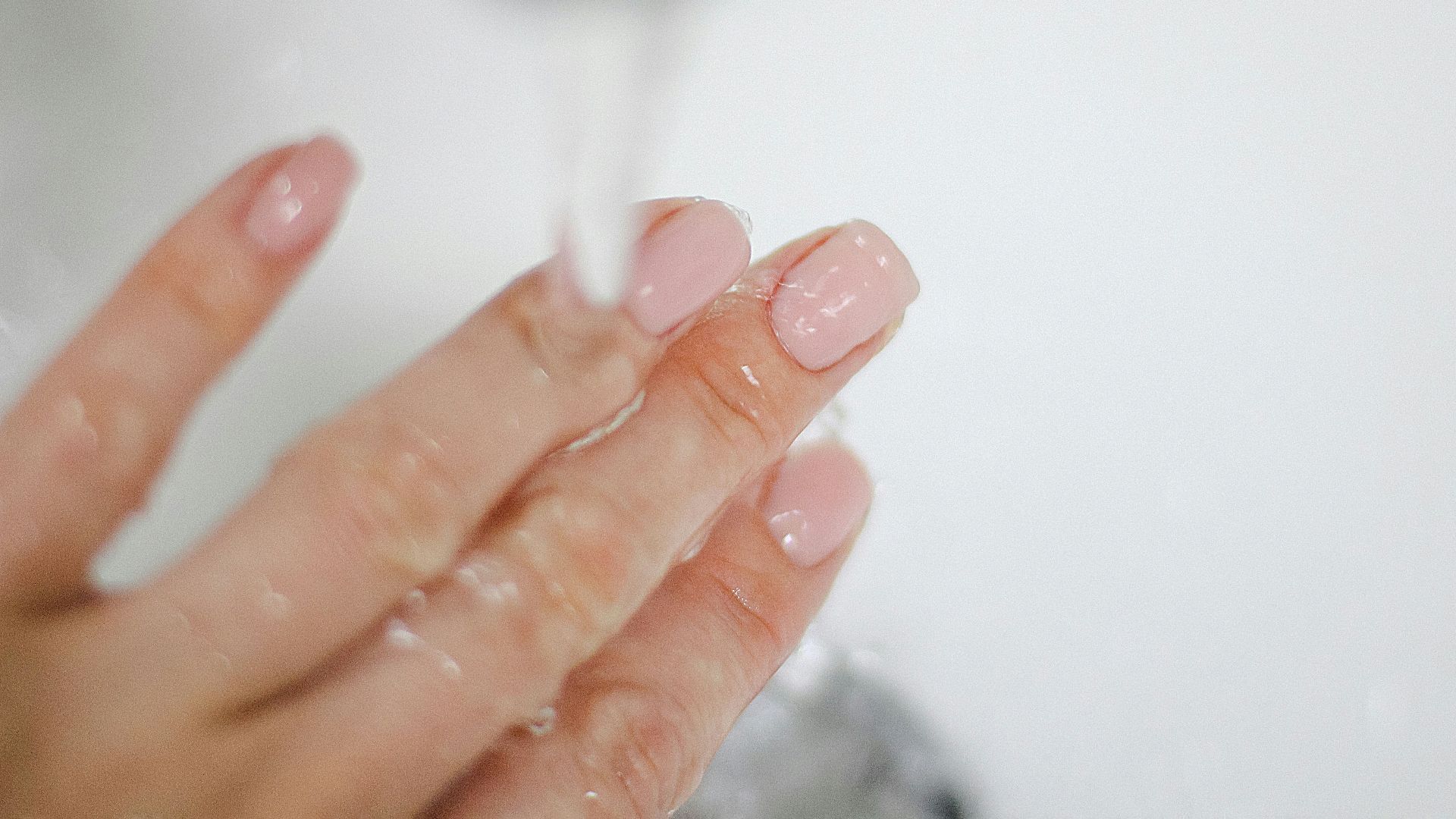 a close-up of a person's hand holding a tube