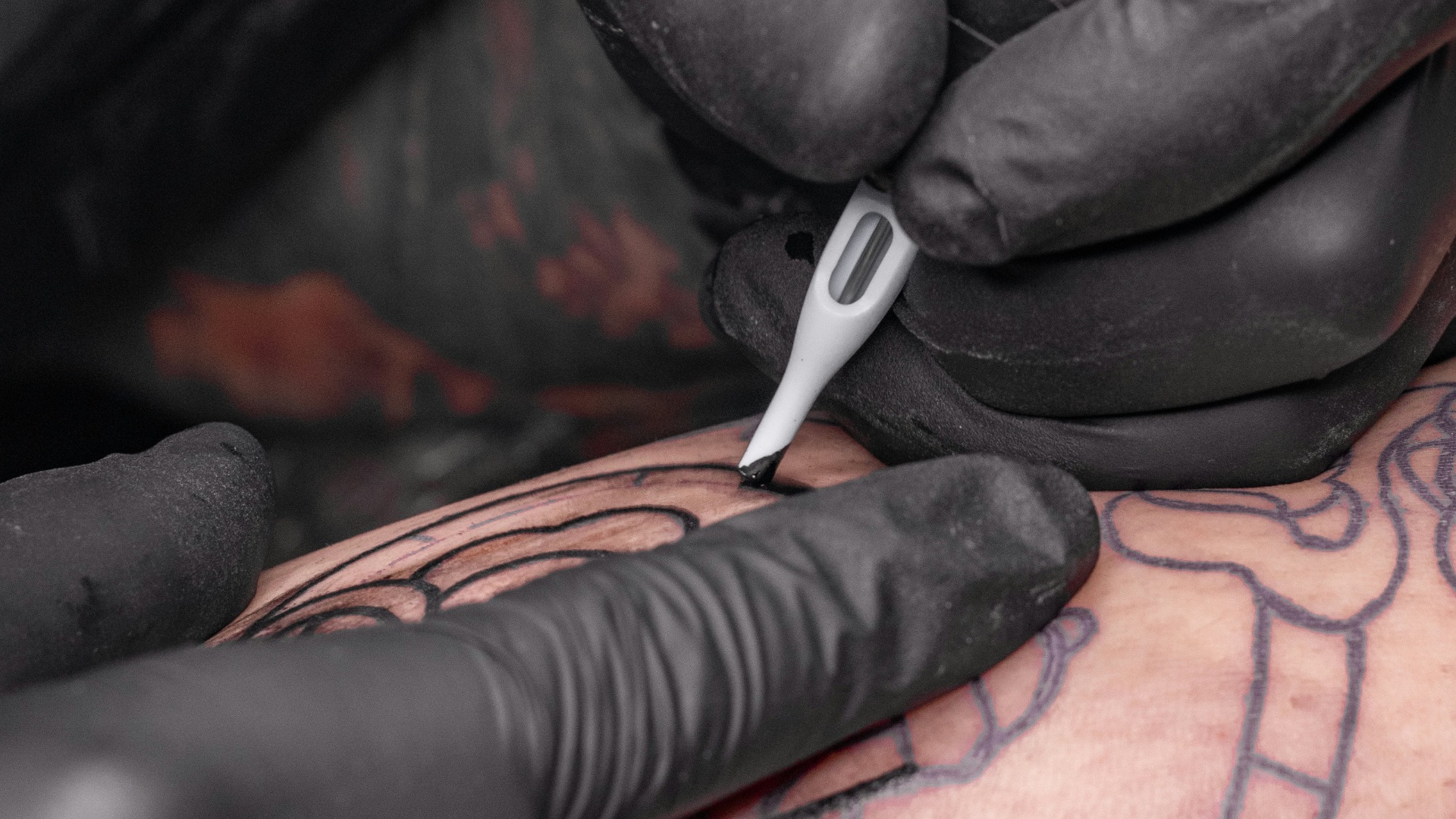 black and silver toy robot on black leather armchair