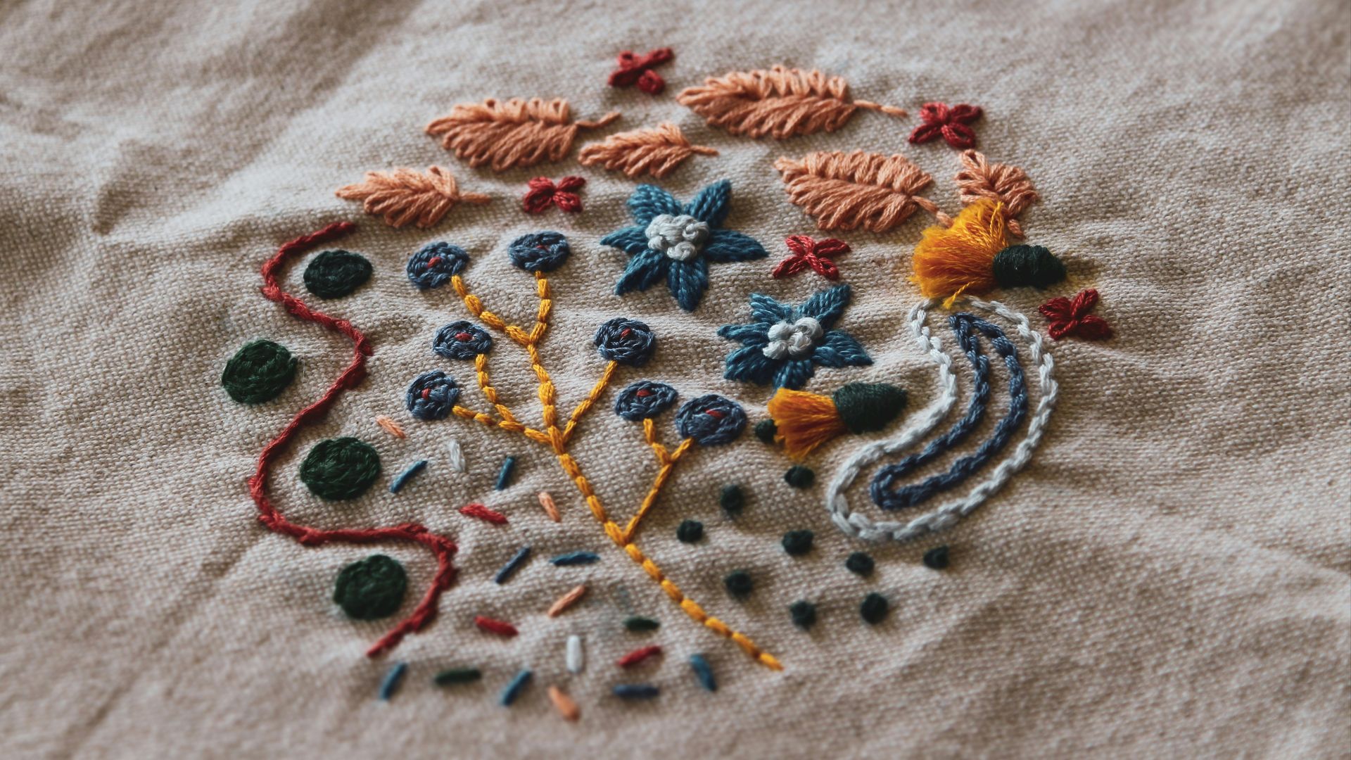 a close up of a embroidered object on a cloth