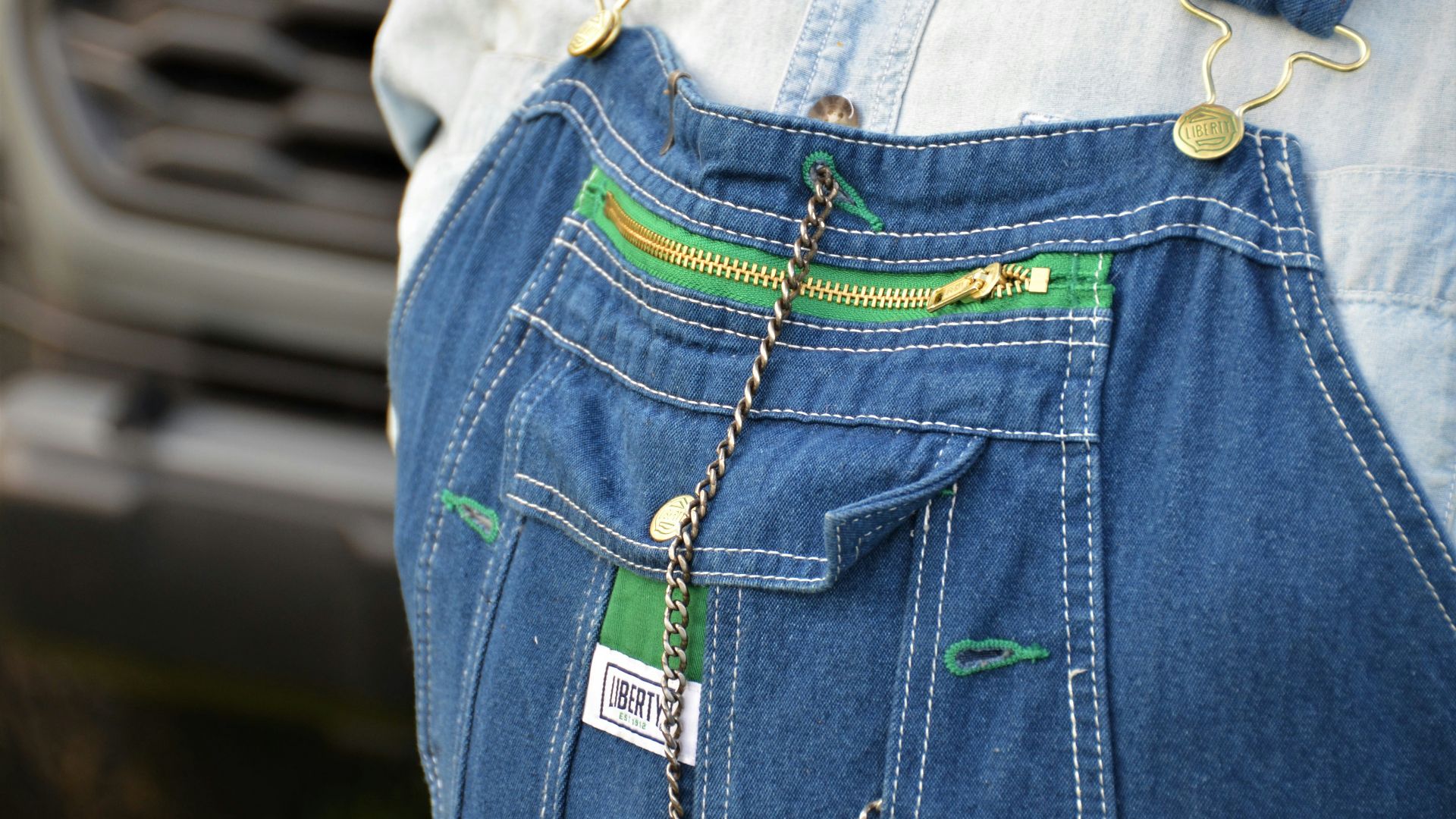 a pair of jeans with a chain attached to them